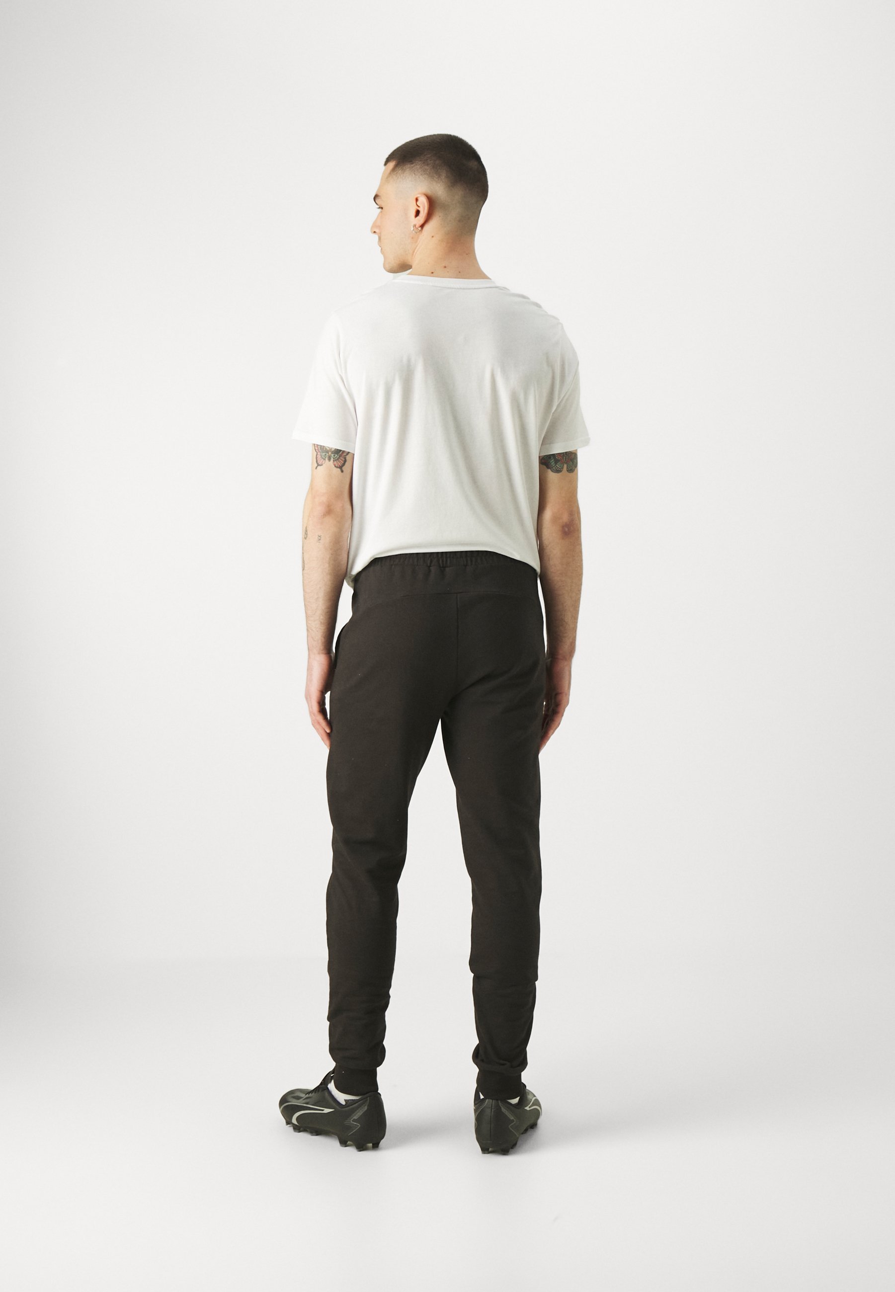 Puma TEAMGOAL CASUALS PANTS - Trainingsbroek - zwart/wit