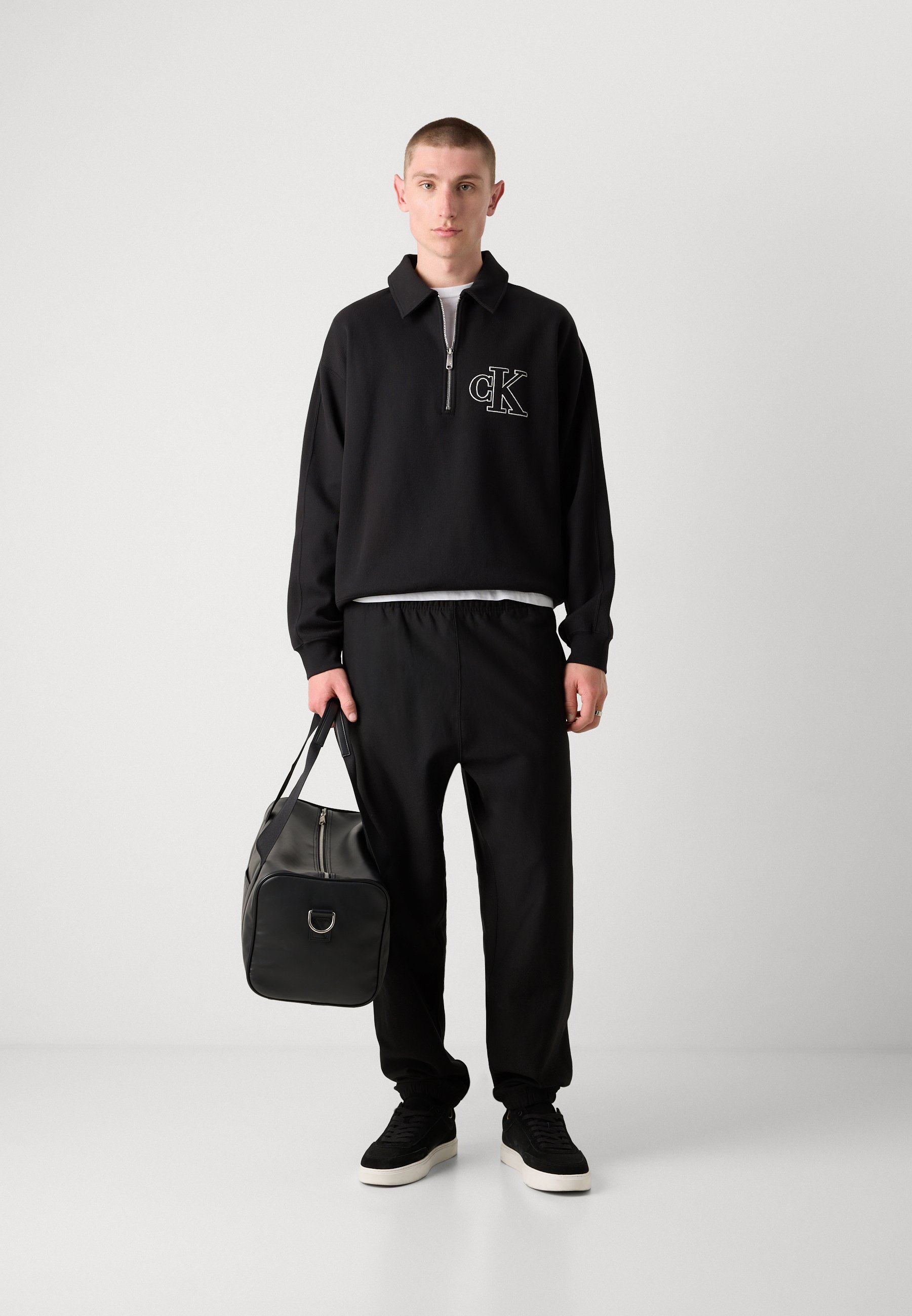 Calvin Klein Jeans PREMIUM MONOGRAM - Dressipüksid - mustad