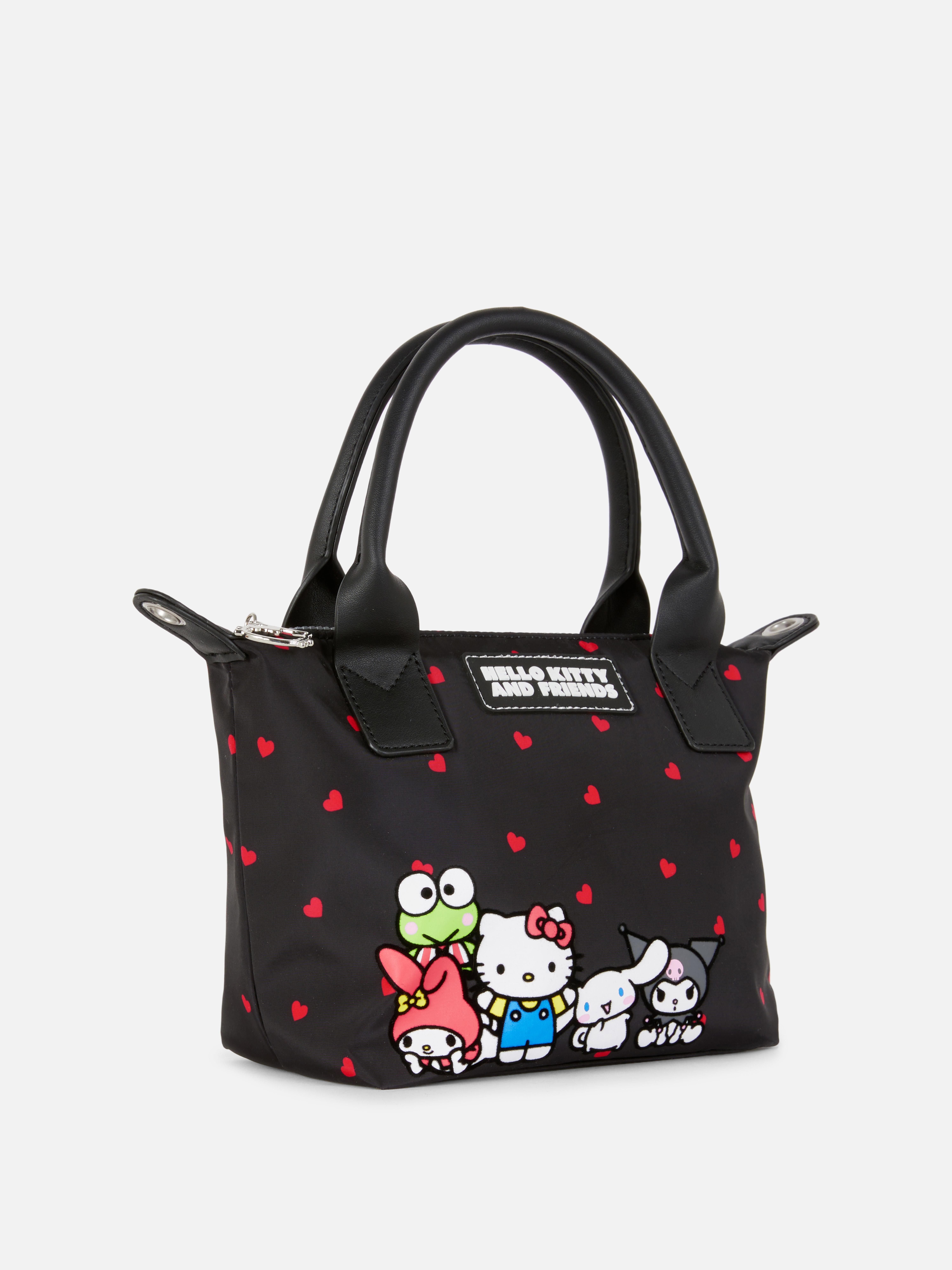 Geantă de umăr Hello Kitty and Friends O geantă de umăr Hello Kitty and Friends cu mânere și fermoar