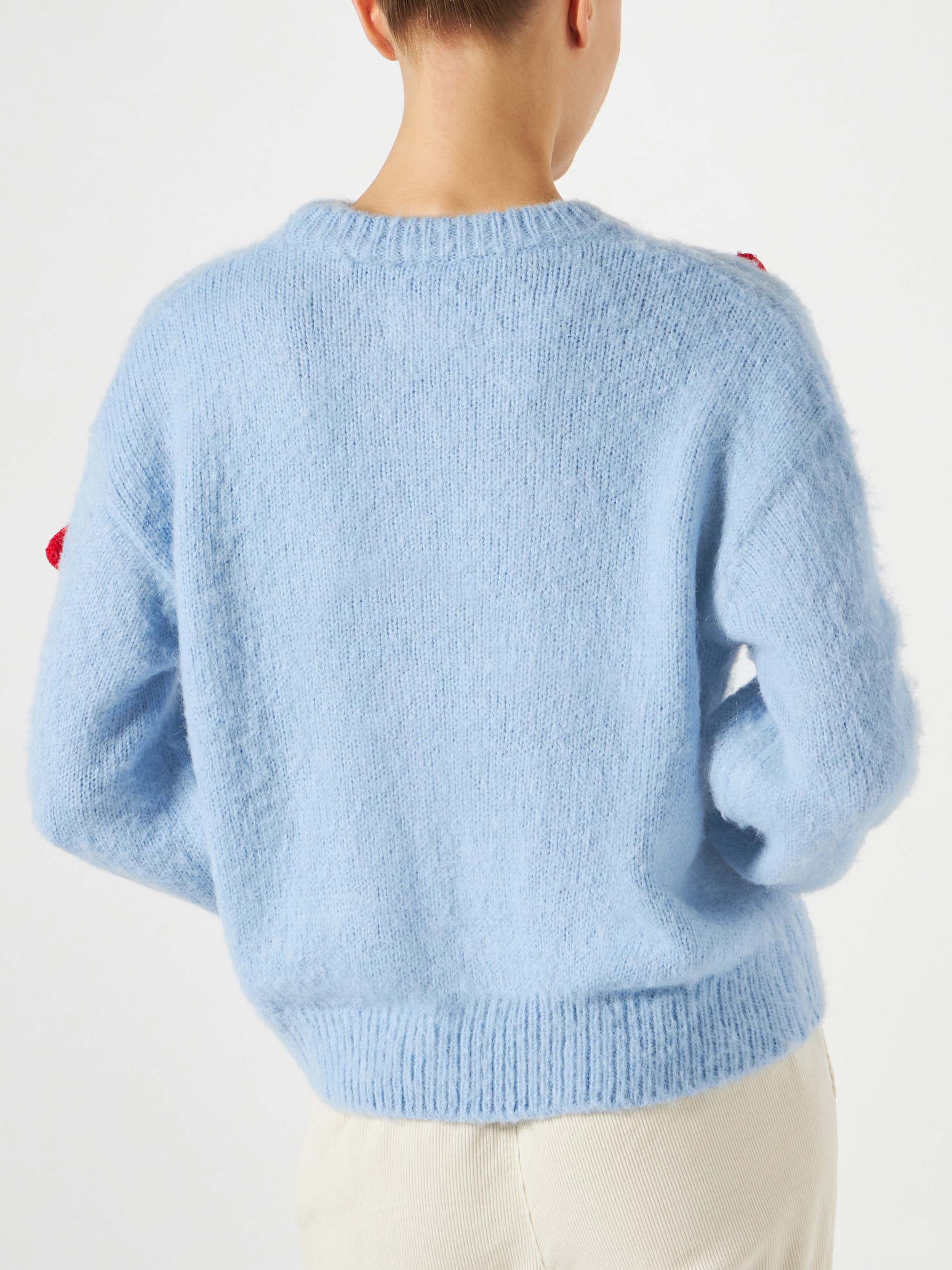 Suéter feminino de gola redonda escovada com aplique de cogumelo.