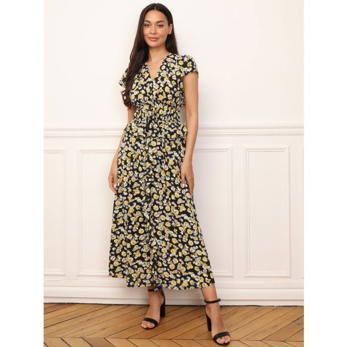Vestido largo estampado floral con volantes en la parte delantera y en la cintura. Cuenta con dos filas de elástico en la cintura y...