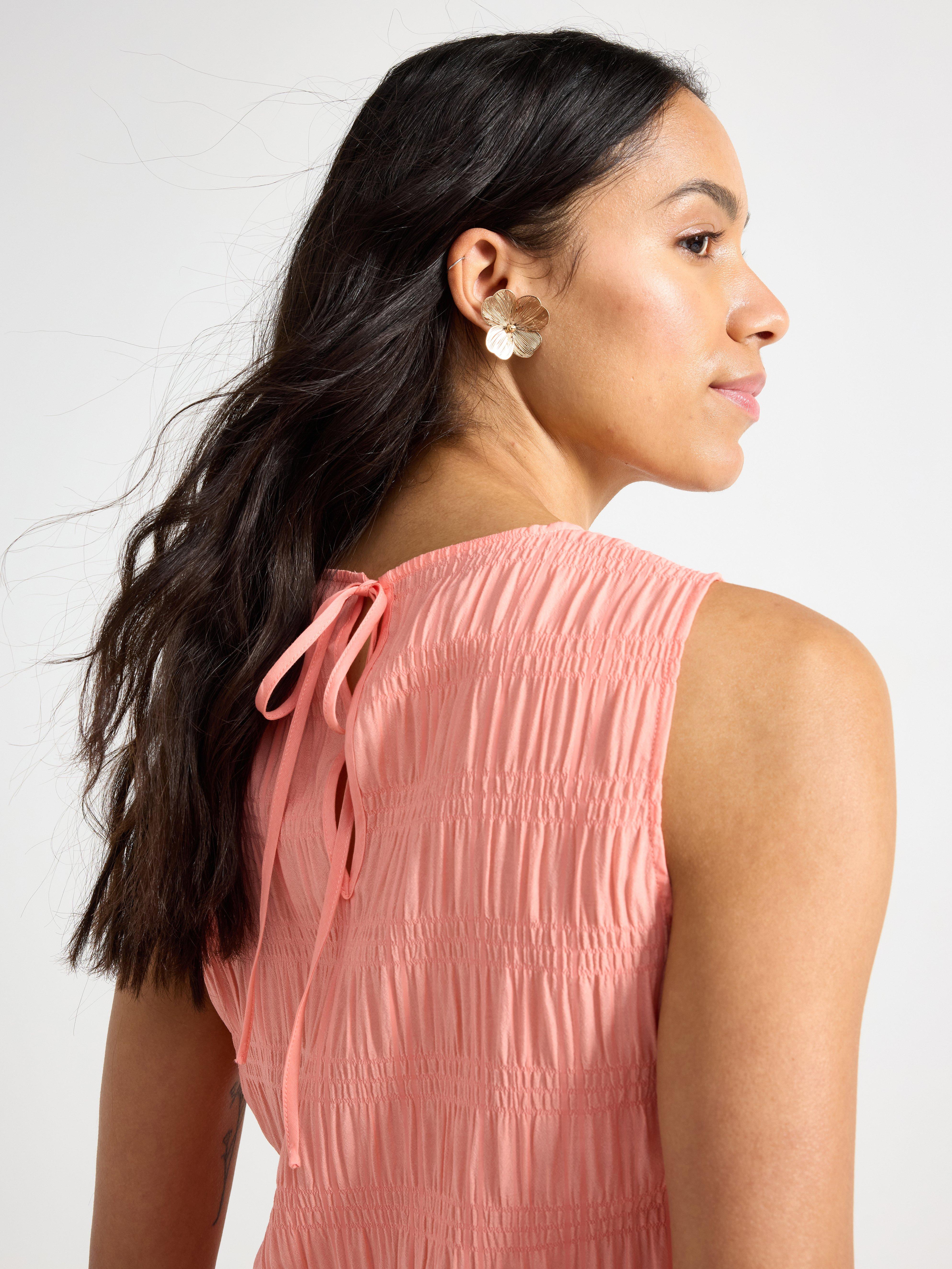 Top sin mangas color coral claro