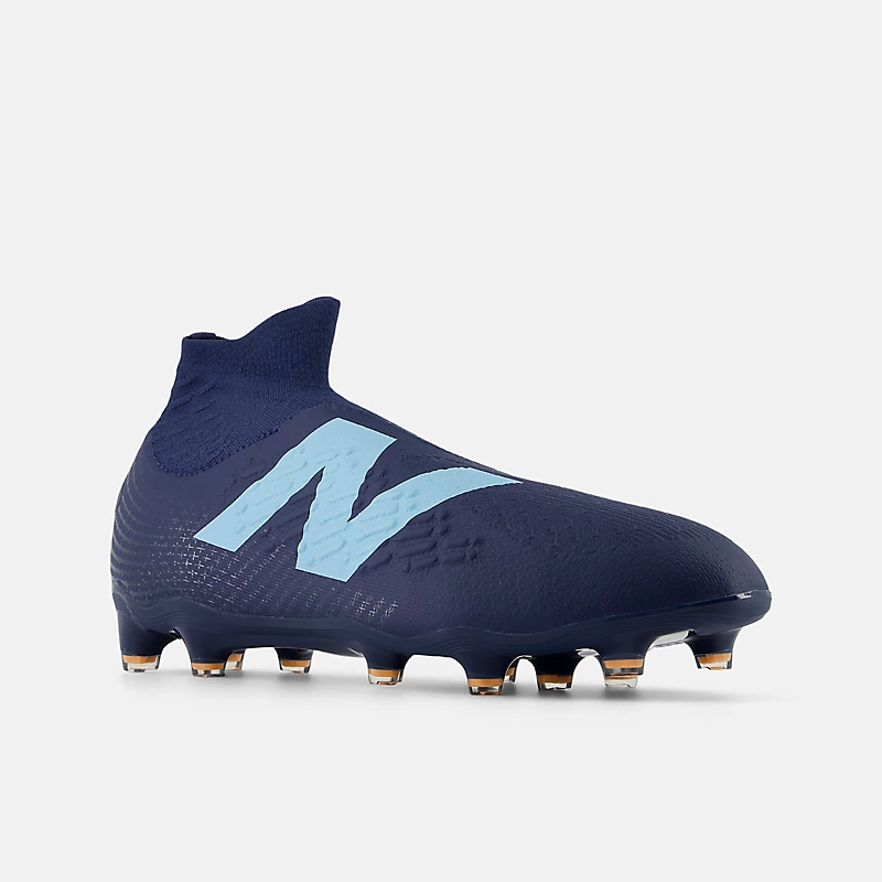 Chuteira unissex TEKELA MAGIA FG V4+ - Azul Marinho NB com detalhes em Azul Celeste e Manga Vibrante
