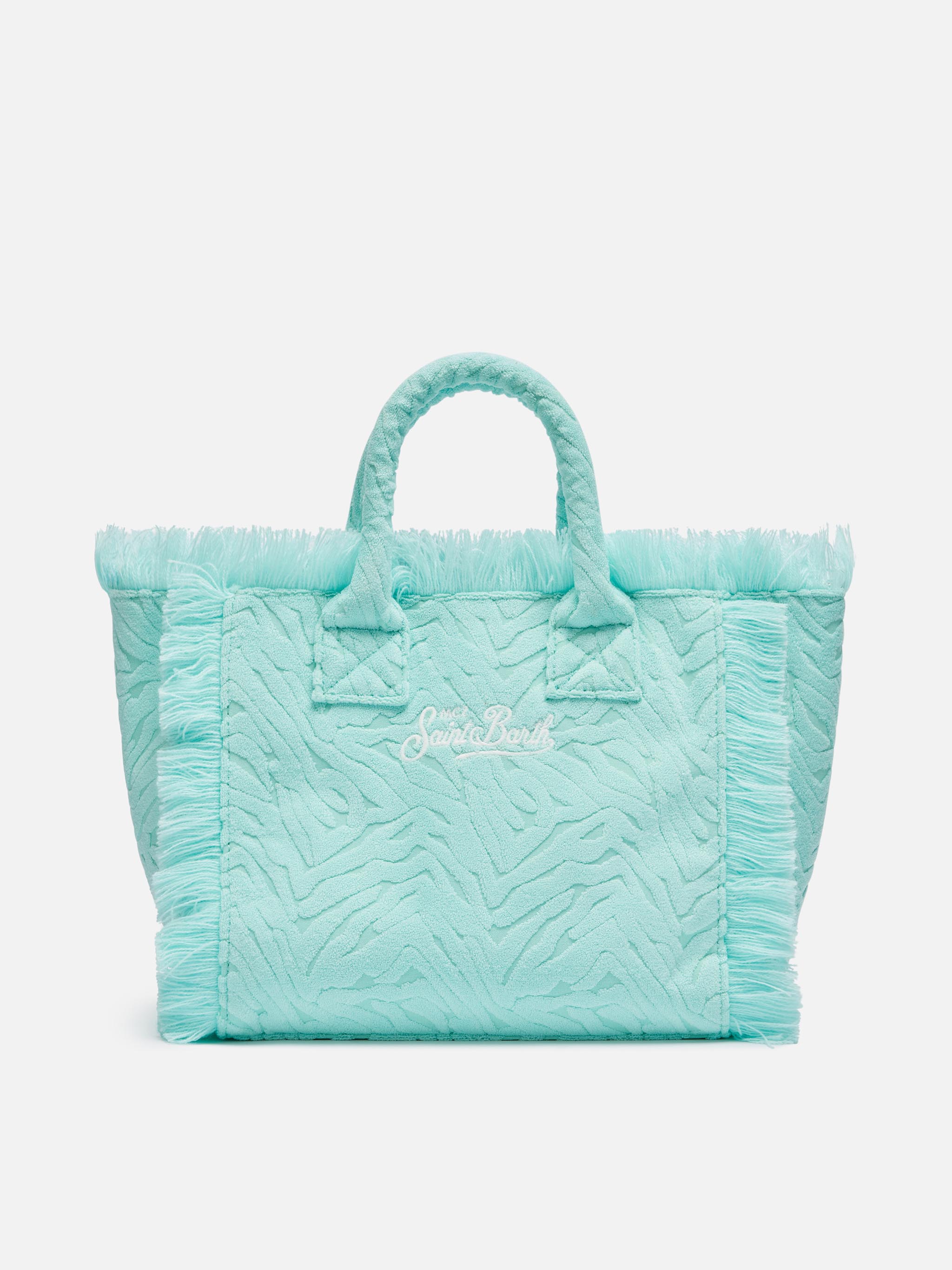Colette-tas van turquoise badstof met reliëf zebraprint.