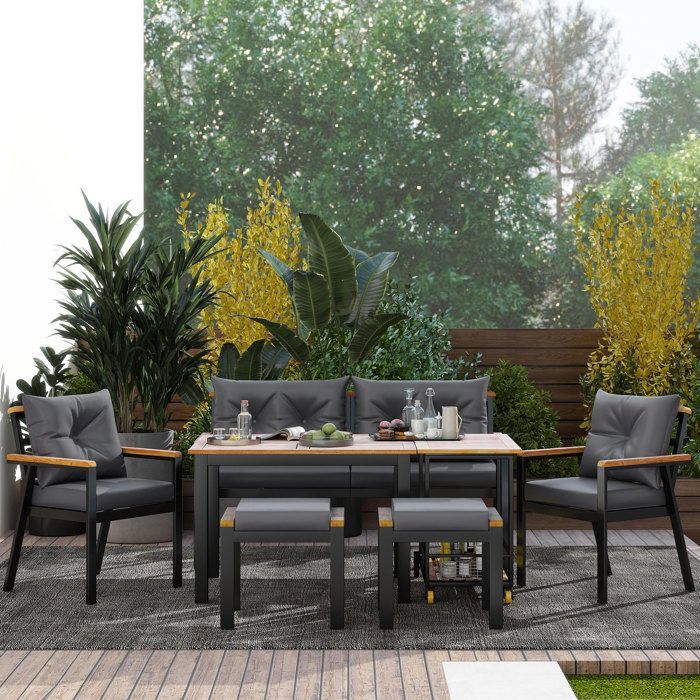 Tavolo da pranzo da giardino per 6-7 persone con sedie, poltrone e carrello portavivande rimovibile, in legno di acacia.