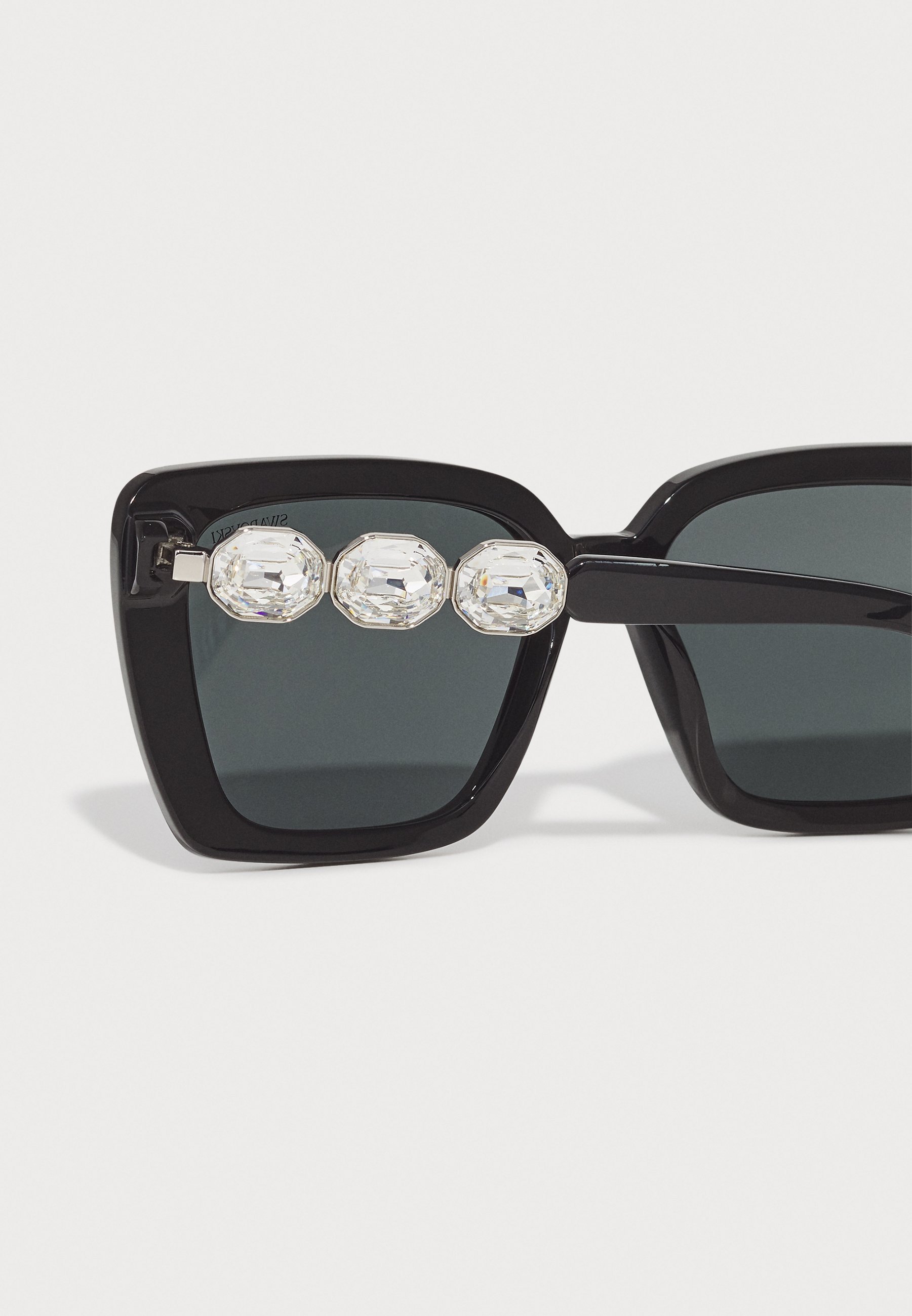 Lunettes de soleil Swarovski - noires