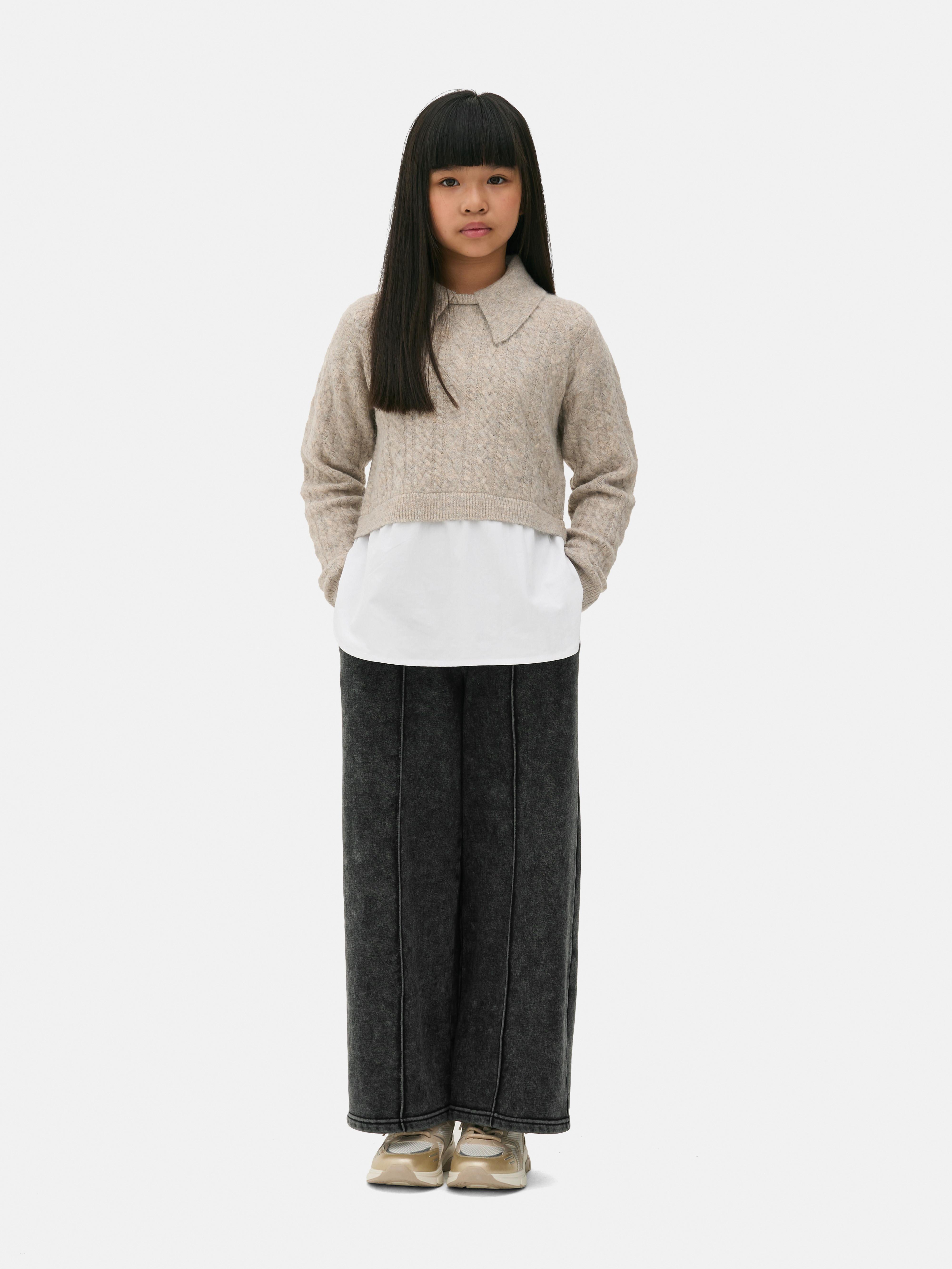 Cable knit sweater with shirt 2-in-1 A cable knit shirt sweater with a collar and ribbed cuffs