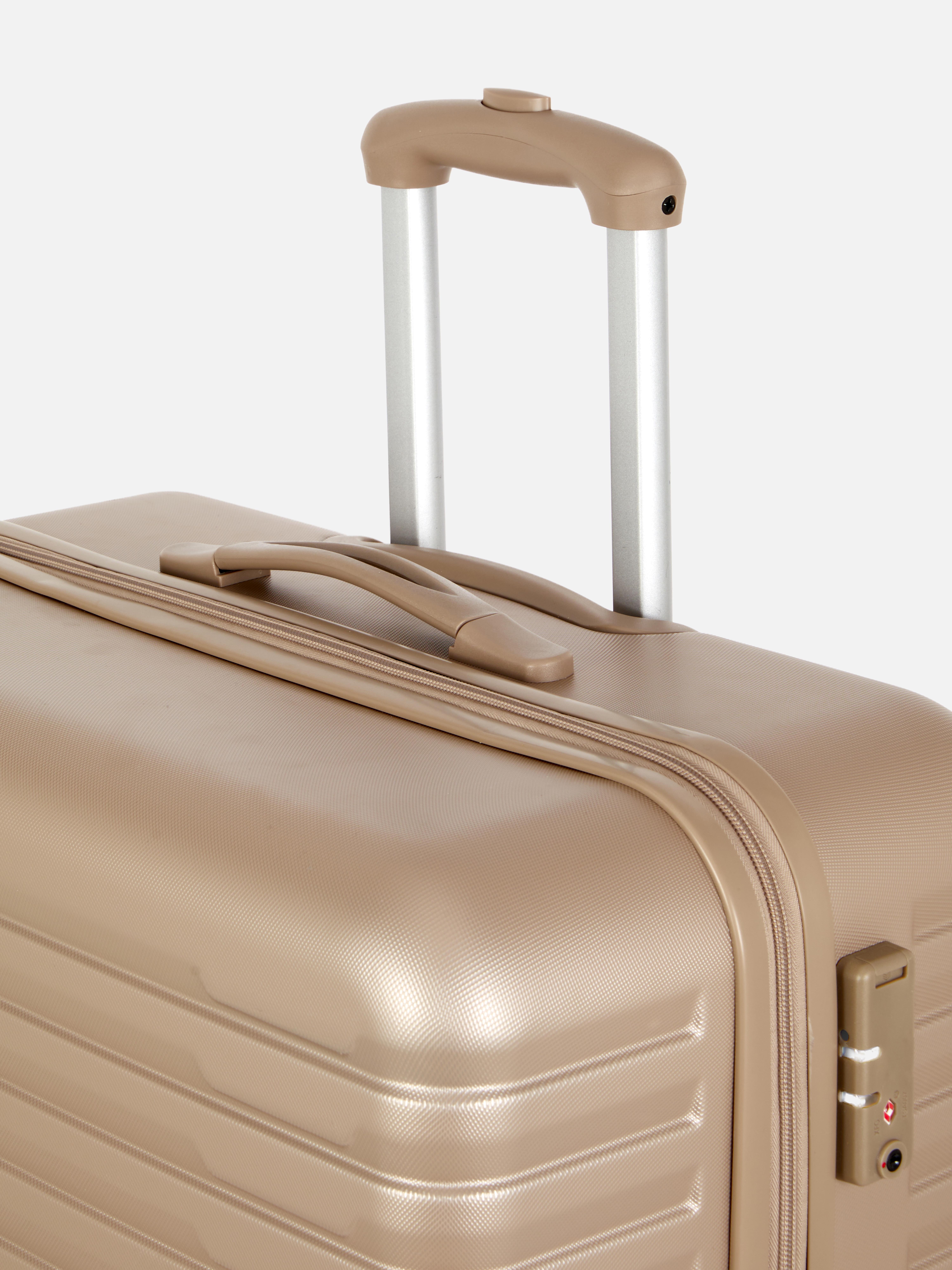 Valiză rigidă cu design striat și patru roți. Valiza noastră rigidă cu patru roți este perfectă pentru următoarea ta vacanță.