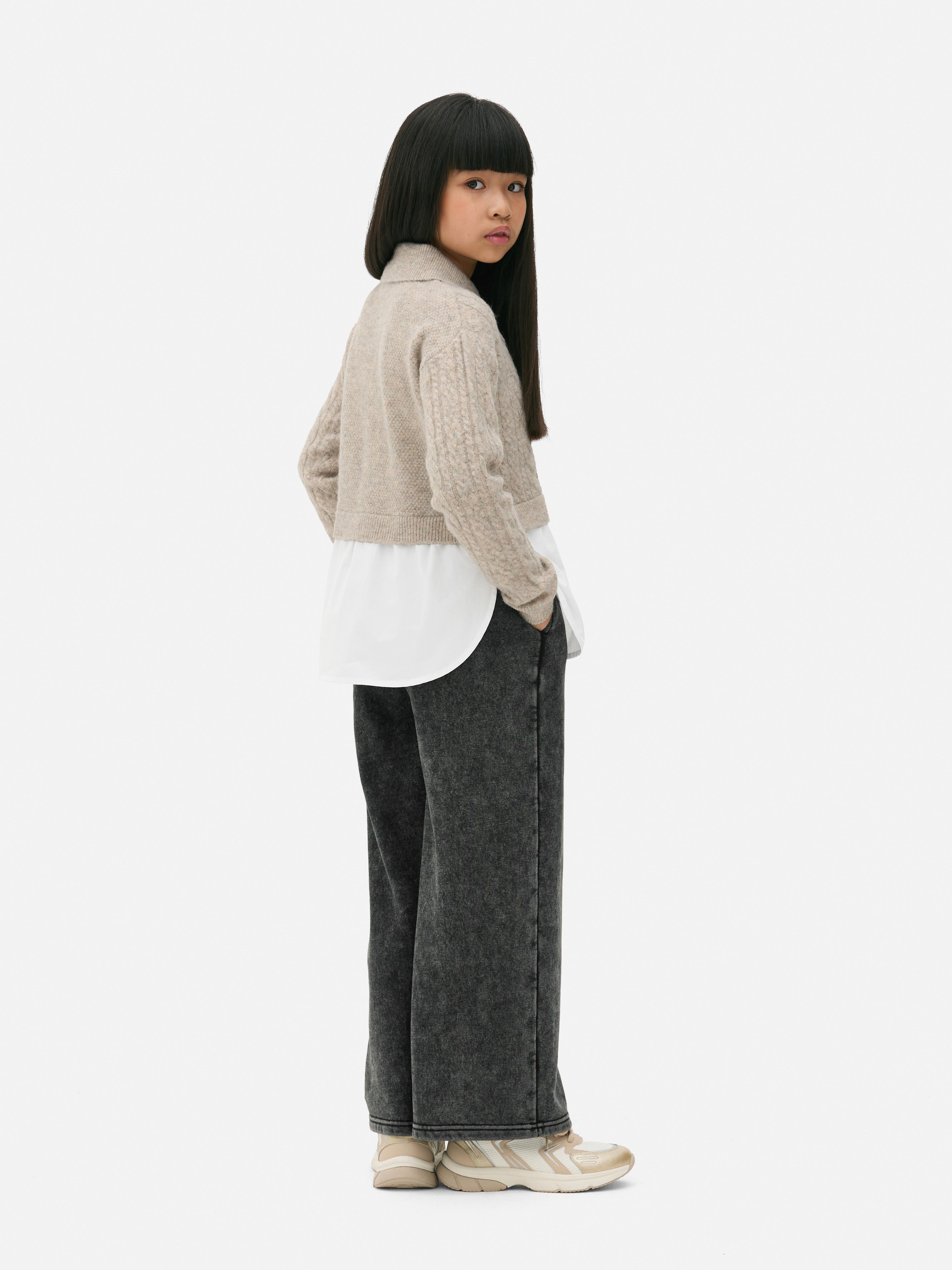 Cable knit sweater with shirt 2-in-1 A cable knit shirt sweater with a collar and ribbed cuffs