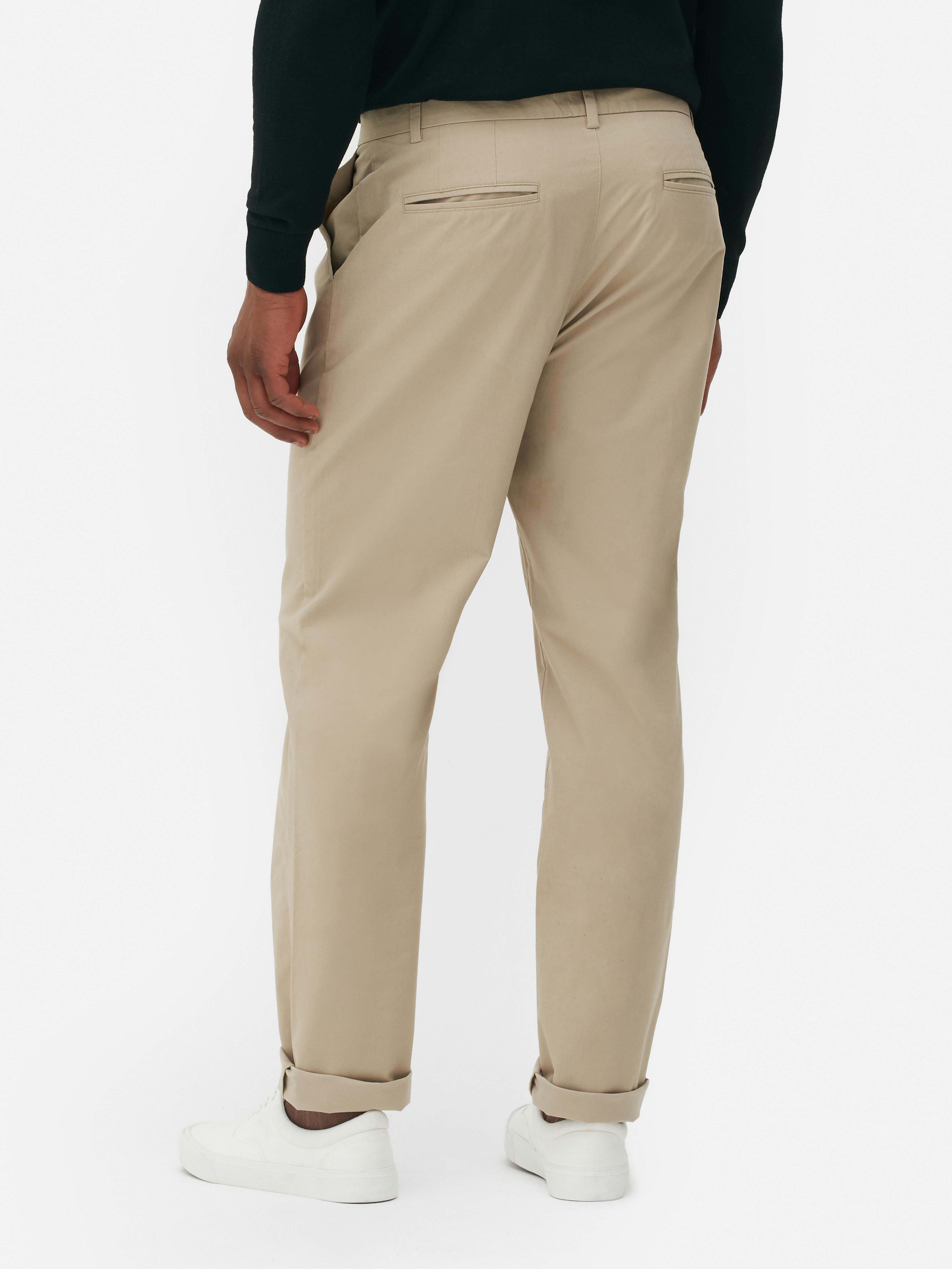 Pantaloni chino elastici cu croială dreaptă, cu închidere ascunsă cu nasturi și buzunare laterale practice
