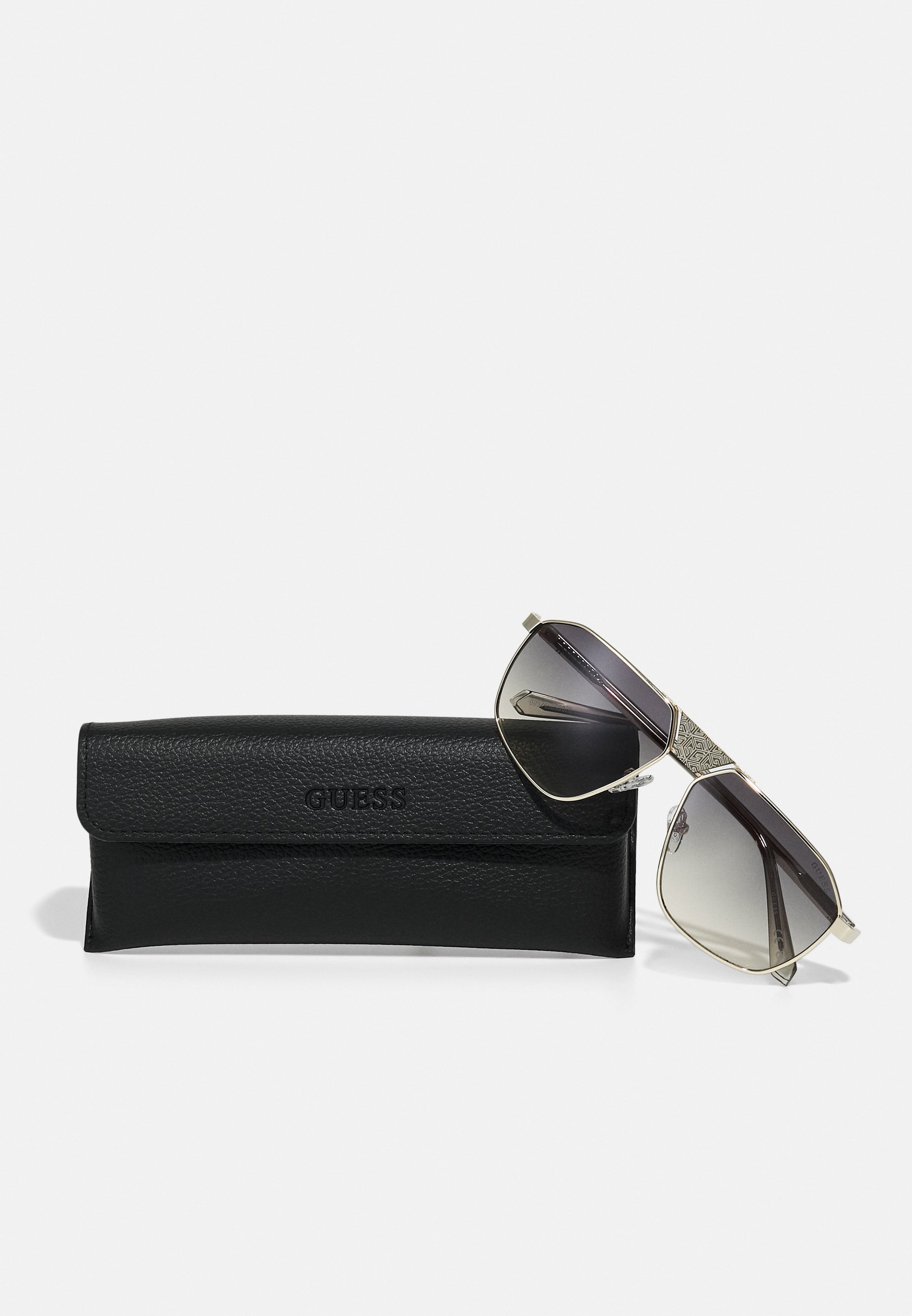 Guess UNISEX - Zonnebril - goudkleurig