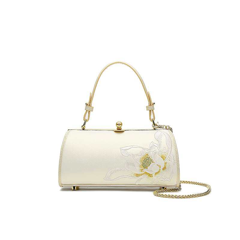 Sac bandoulière léger et élégant en cuir brodé pour femme, avec chaîne.