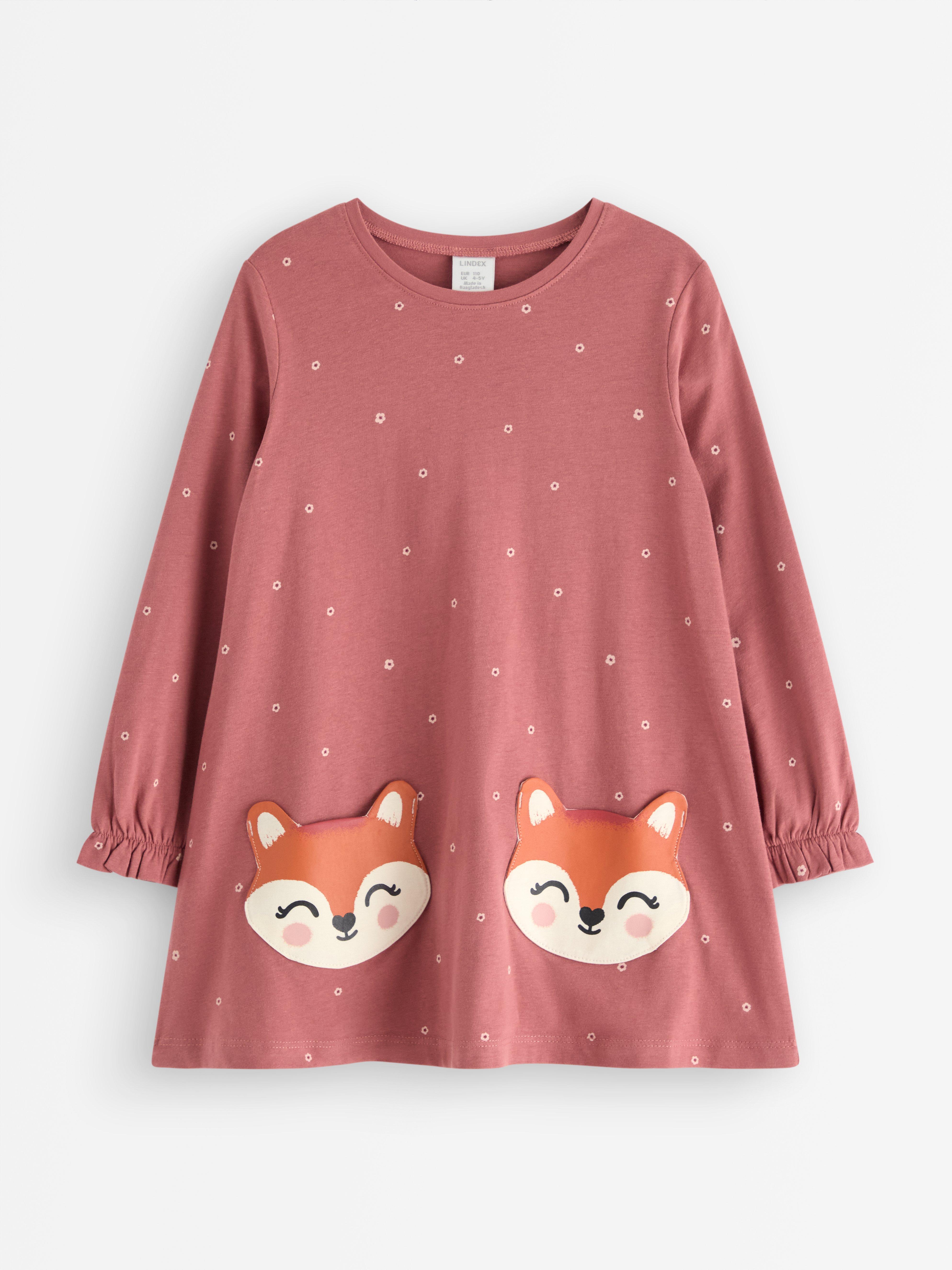 Túnica de manga comprida com bolsos divertidos. Rosa escuro acinzentado.