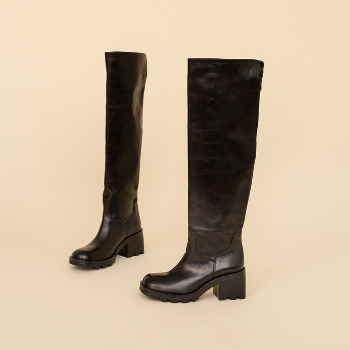 Bottes à talons et semelles crantées  en cuir noir