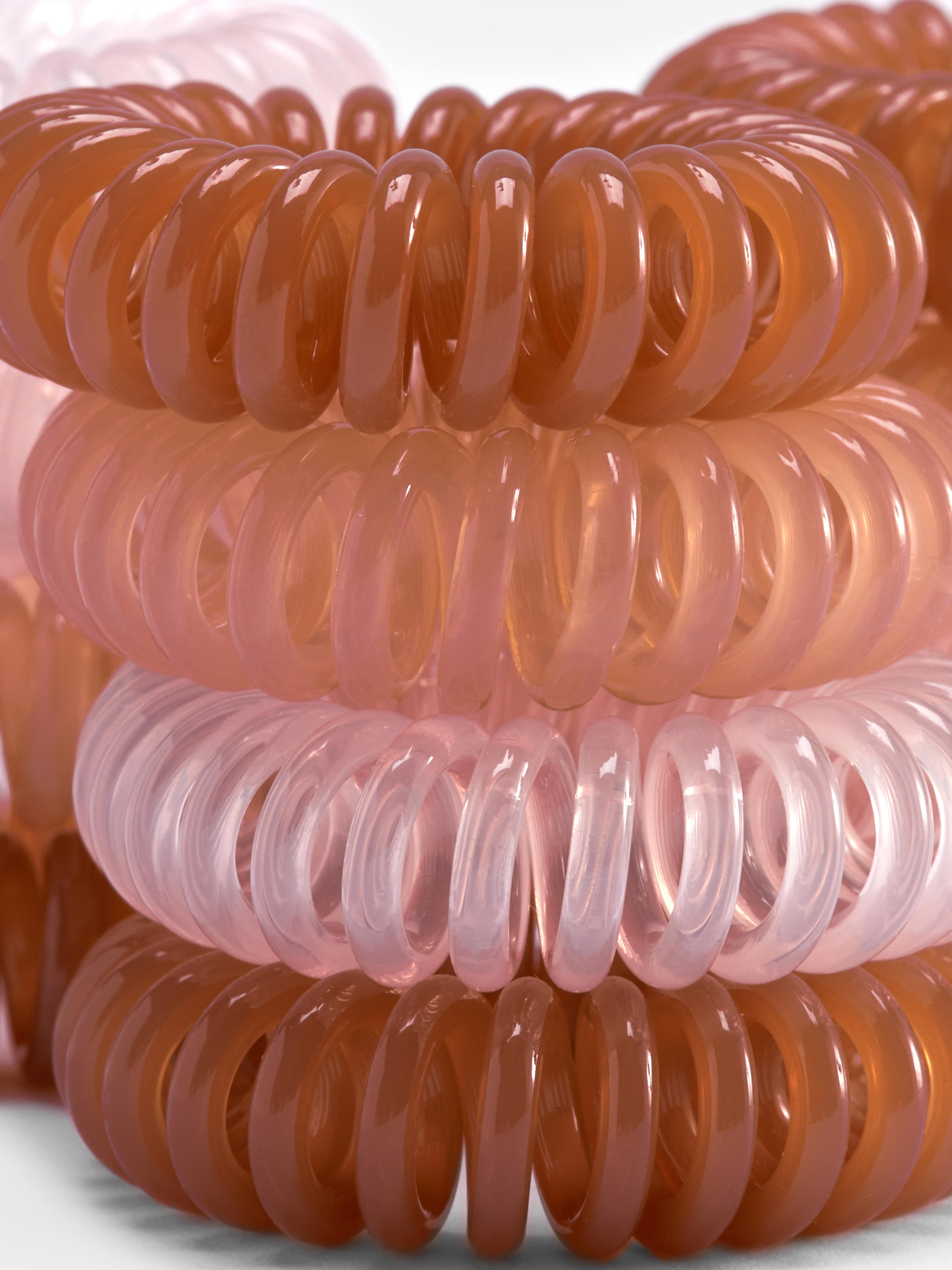 Spiralhaargummis, 12er-Set. Binden Sie Ihr Haar mit unseren Spiralhaargummis nahtlos zu einem Pferdeschwanz.