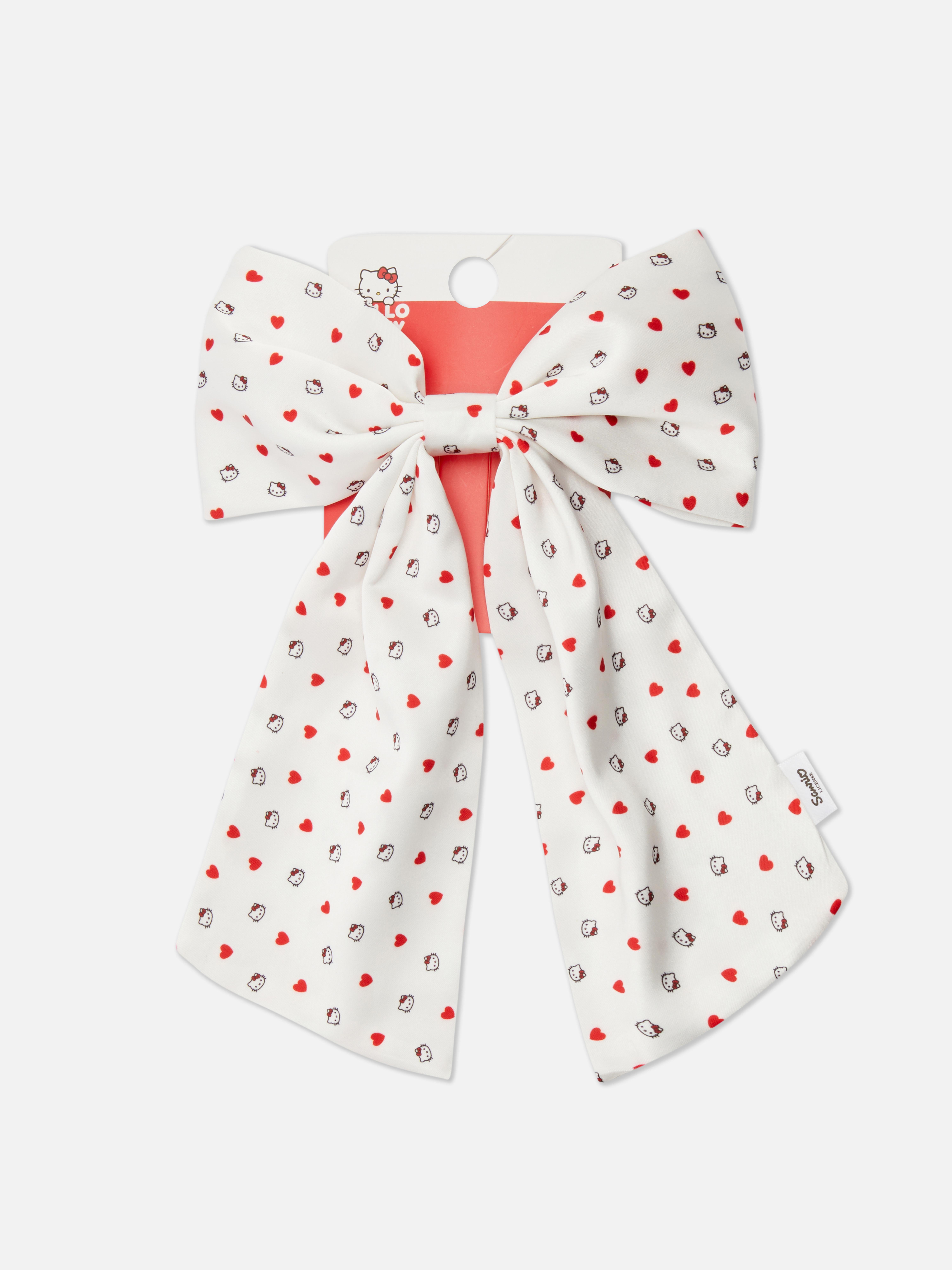 Hello Kitty hajmasni Ez a hajmasni Hello Kitty motívumokkal díszített mintával díszített.