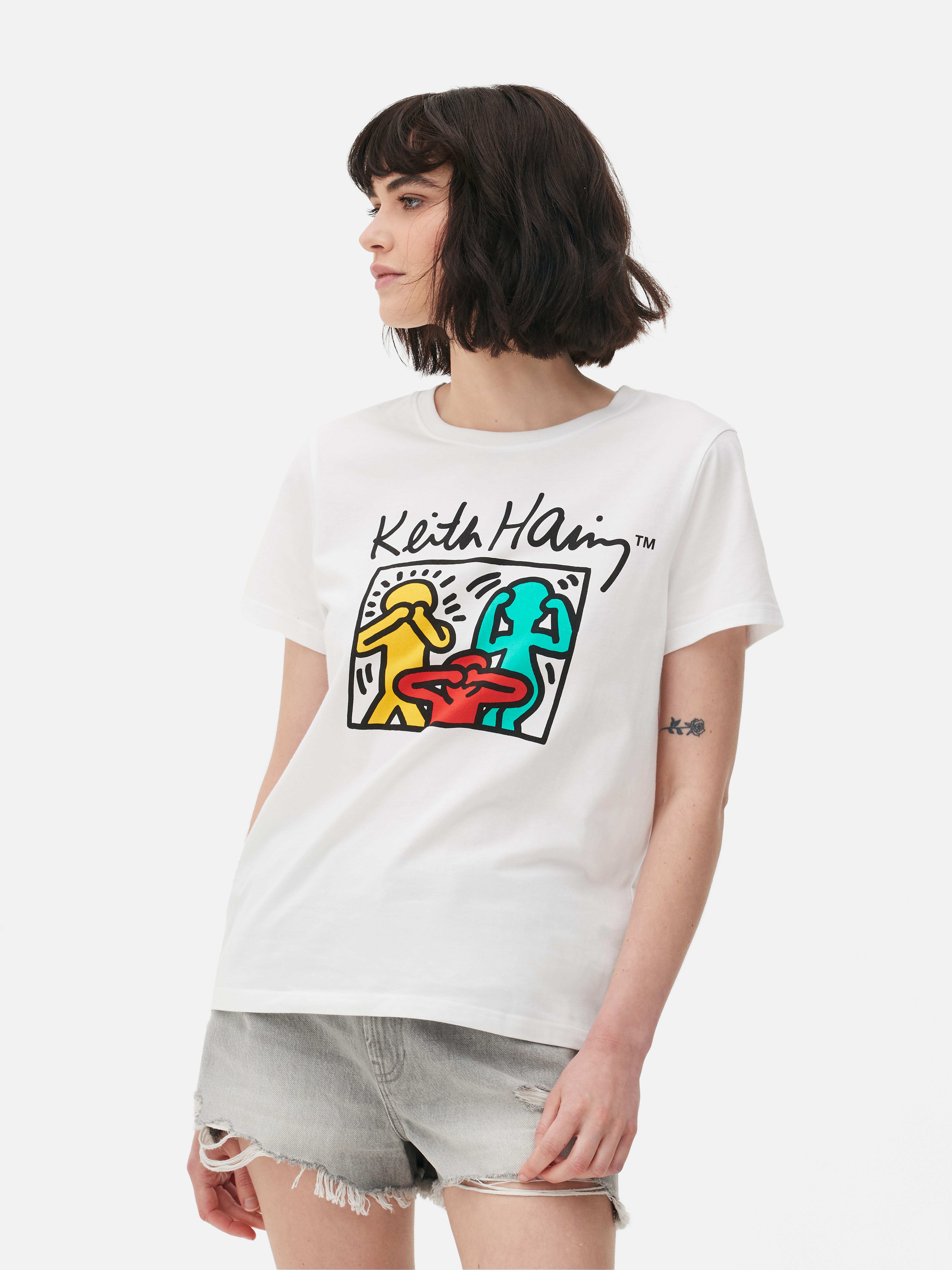 Tricou cu imprimeu Keith Haring Înveselește-ți colecția cu acest tricou cu mânecă scurtă, care prezintă culorile vibrante și figurile funky ale lui Keith Haring.