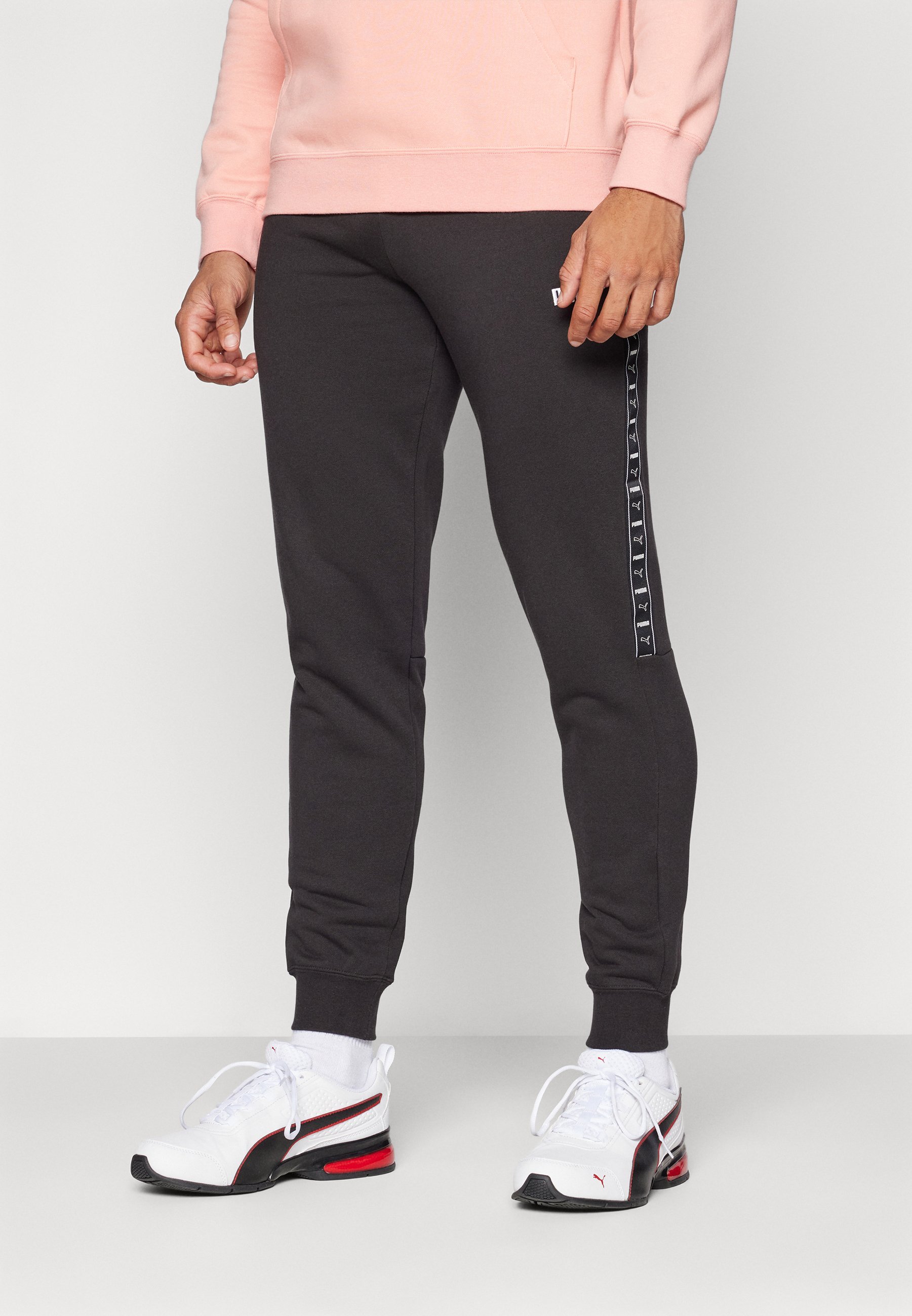 Puma TAPE SWEATPANTS - Spodnji del trenirke - črn