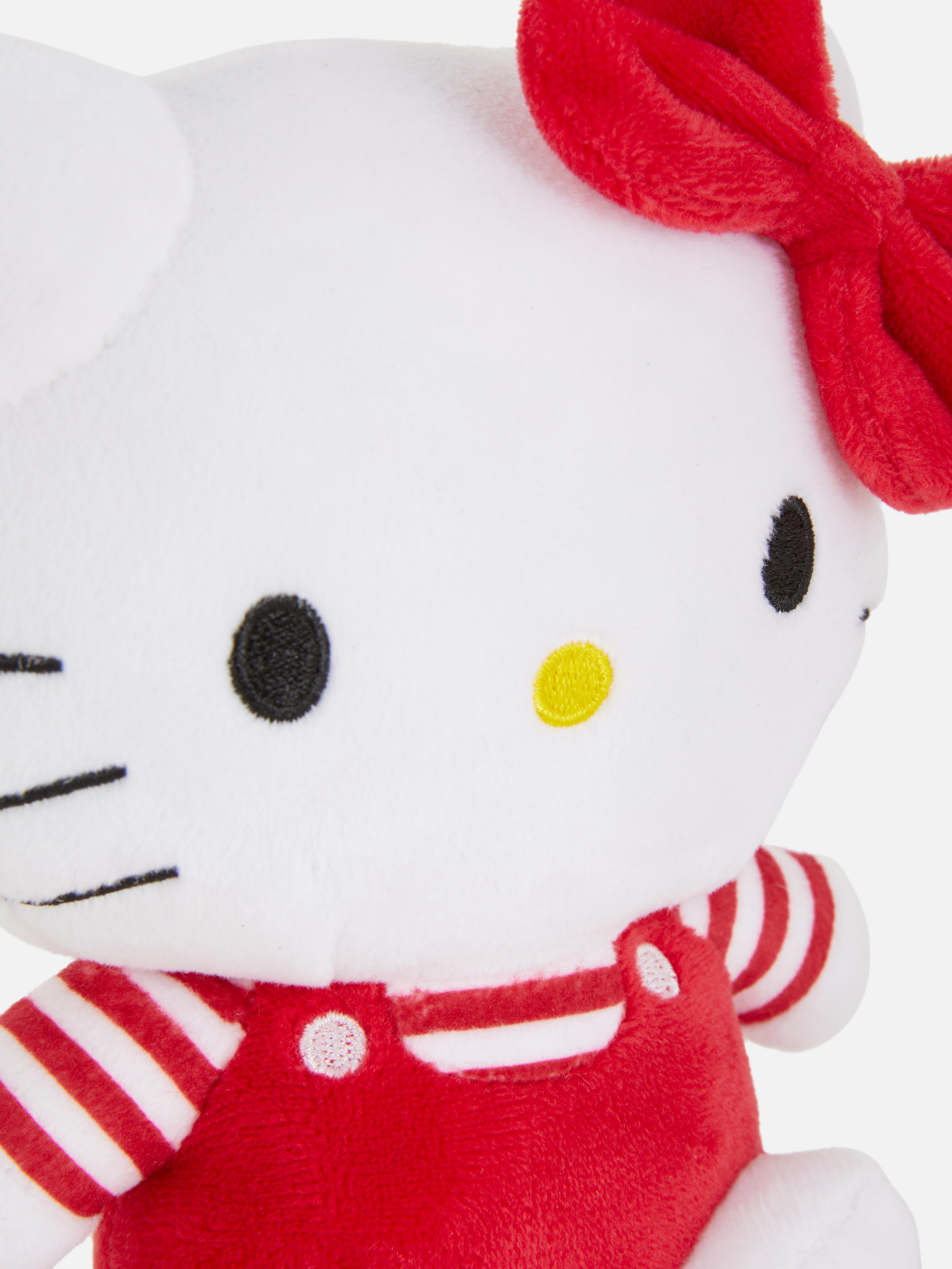 Mágneses Hello Kitty vállra akasztható plüssjáték Egy aranyos Hello Kitty formájú vállra akasztható plüssjáték