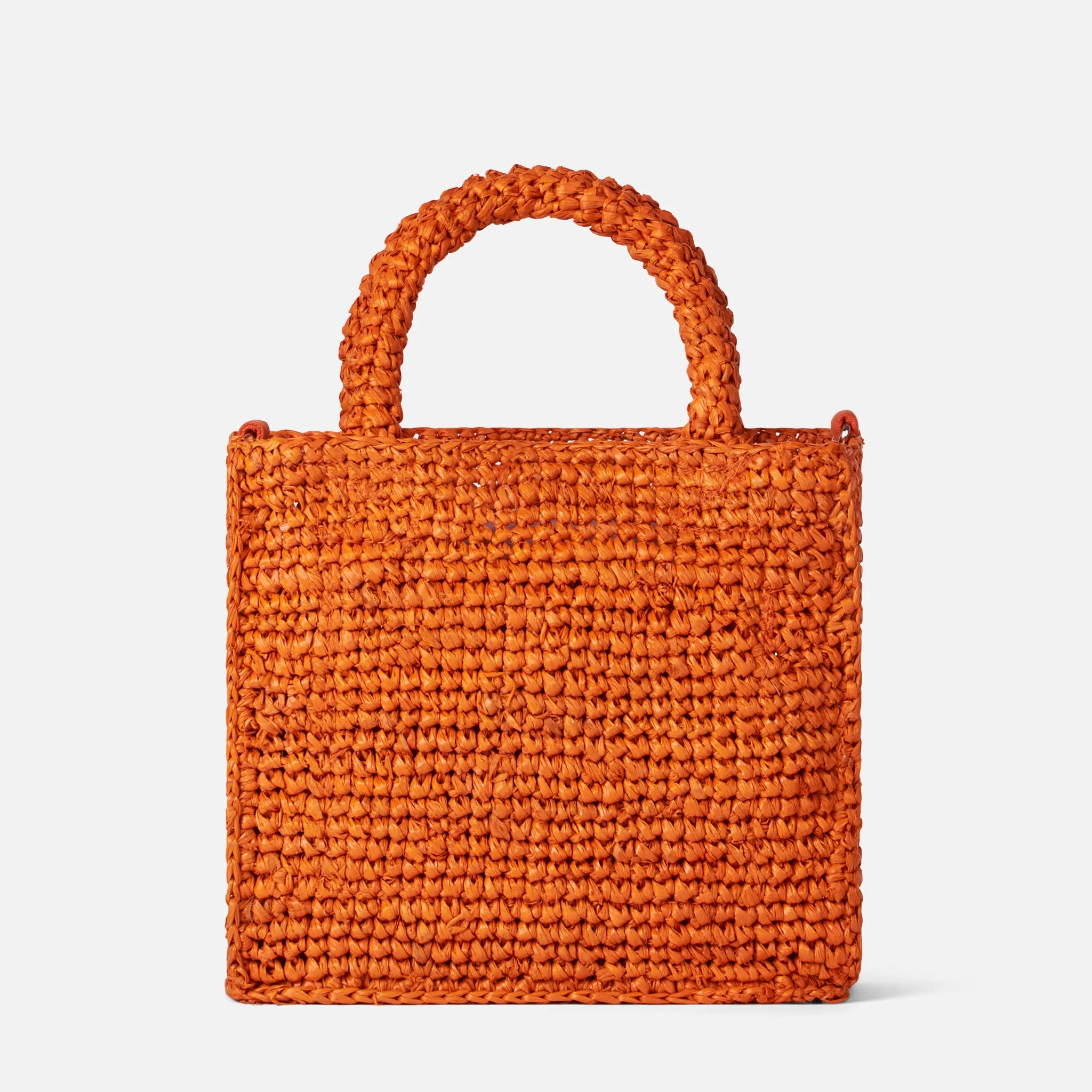 Mini toilettasje van oranje raffia met borduurwerk aan de voorkant
