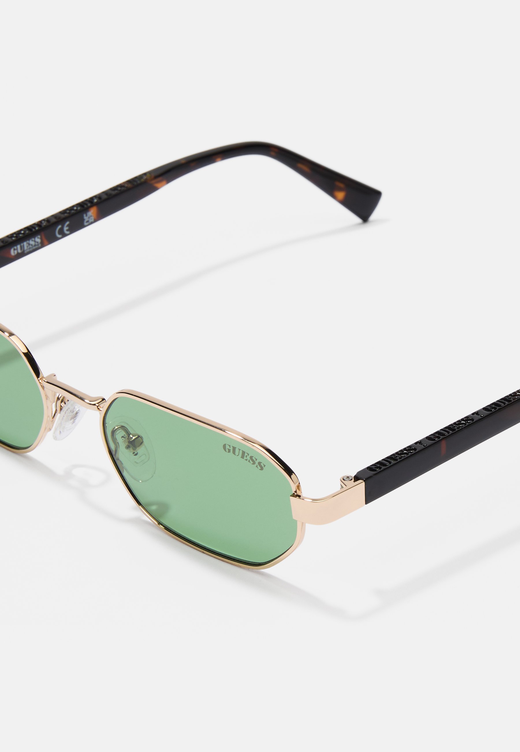 Guess UNISEX - Zonnebril - goudkleurig