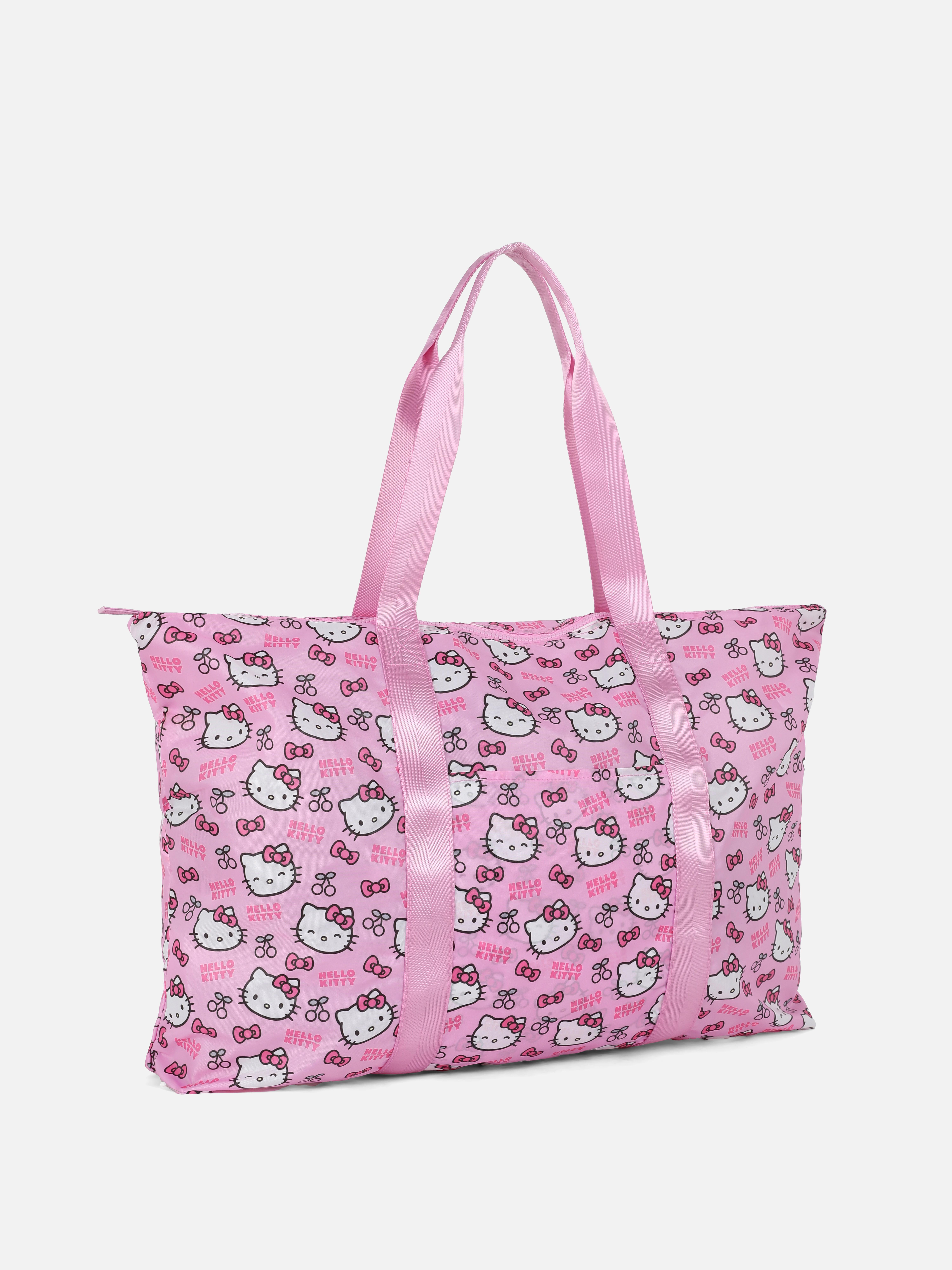 Geantă de călătorie pliabilă Hello Kitty Geanta noastră de călătorie pliabilă Hello Kitty cu bretele țesute este ideală pentru călătorii scurte