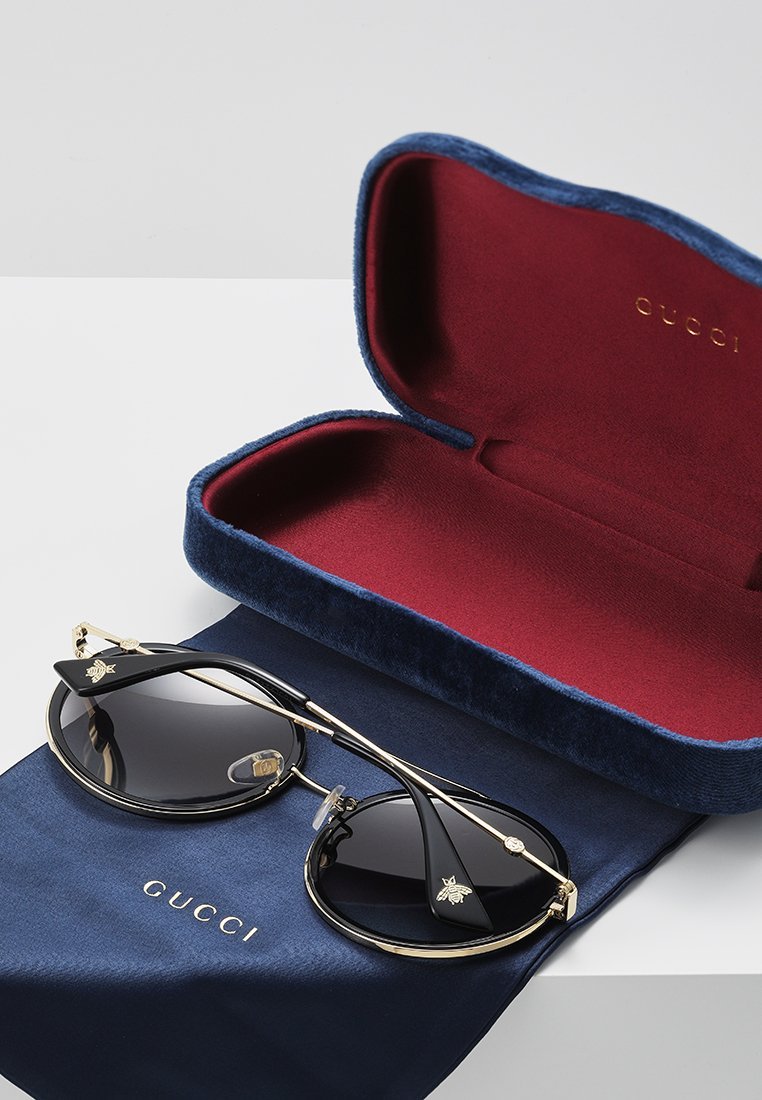Gucci zonnebril - goudkleurig/grijs
