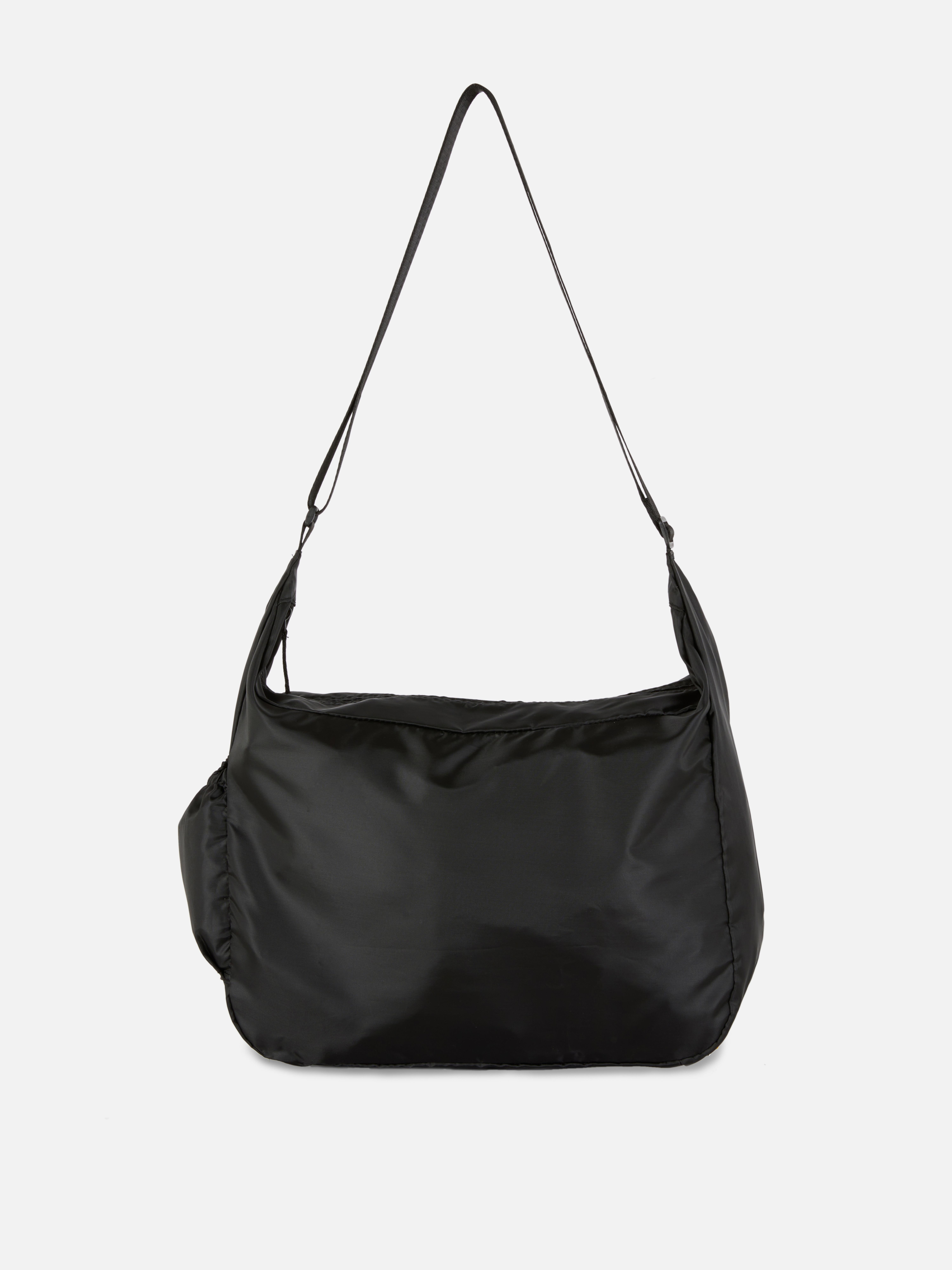 Faltbare Schultertasche Diese Schultertasche wird mit einer eigenen Tragetasche zur Aufbewahrung geliefert.