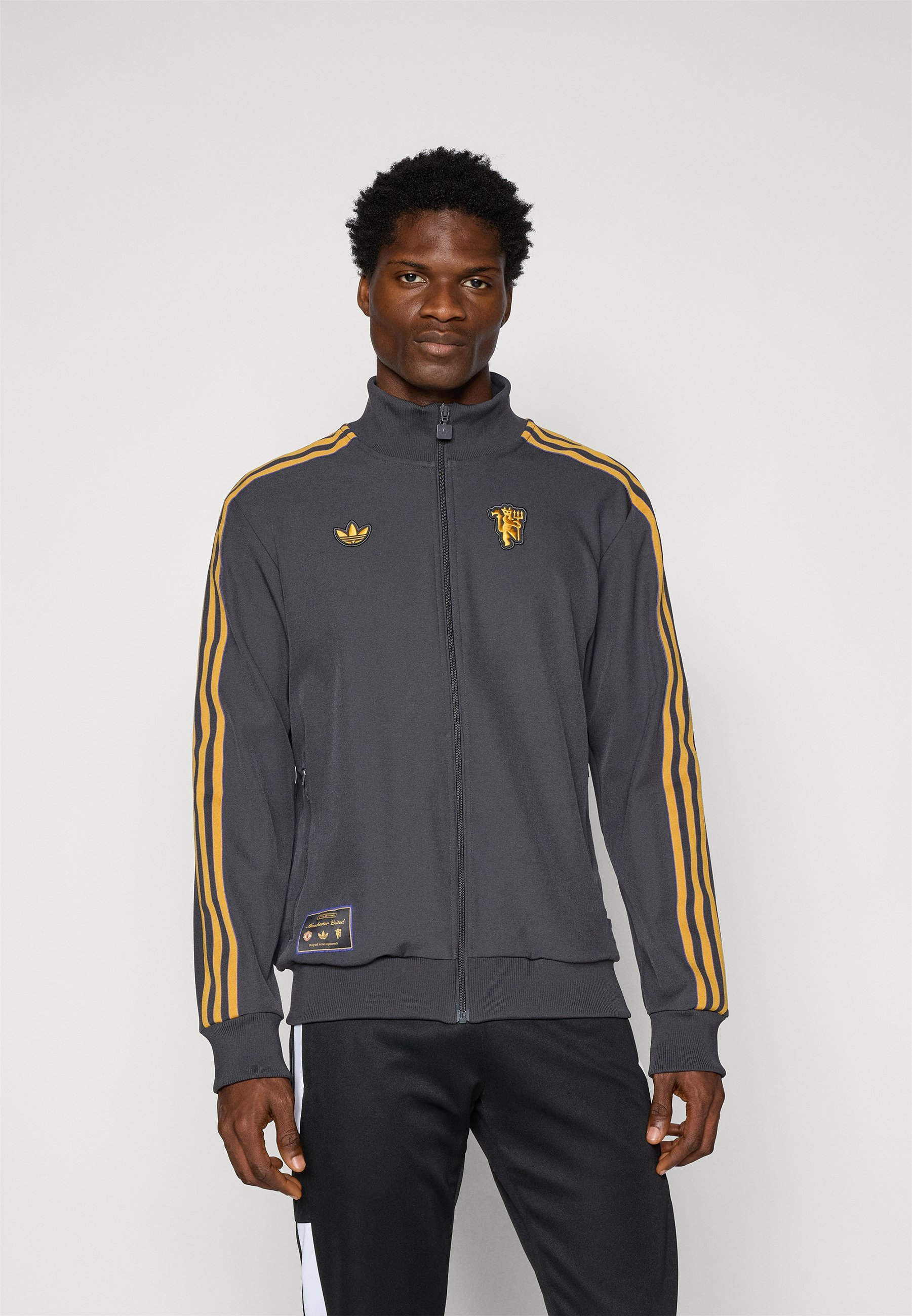 adidas Originals MANCHESTER UNITED ICON MELEGÍTŐPAPÍR - Cipzáras pulóver - fekete