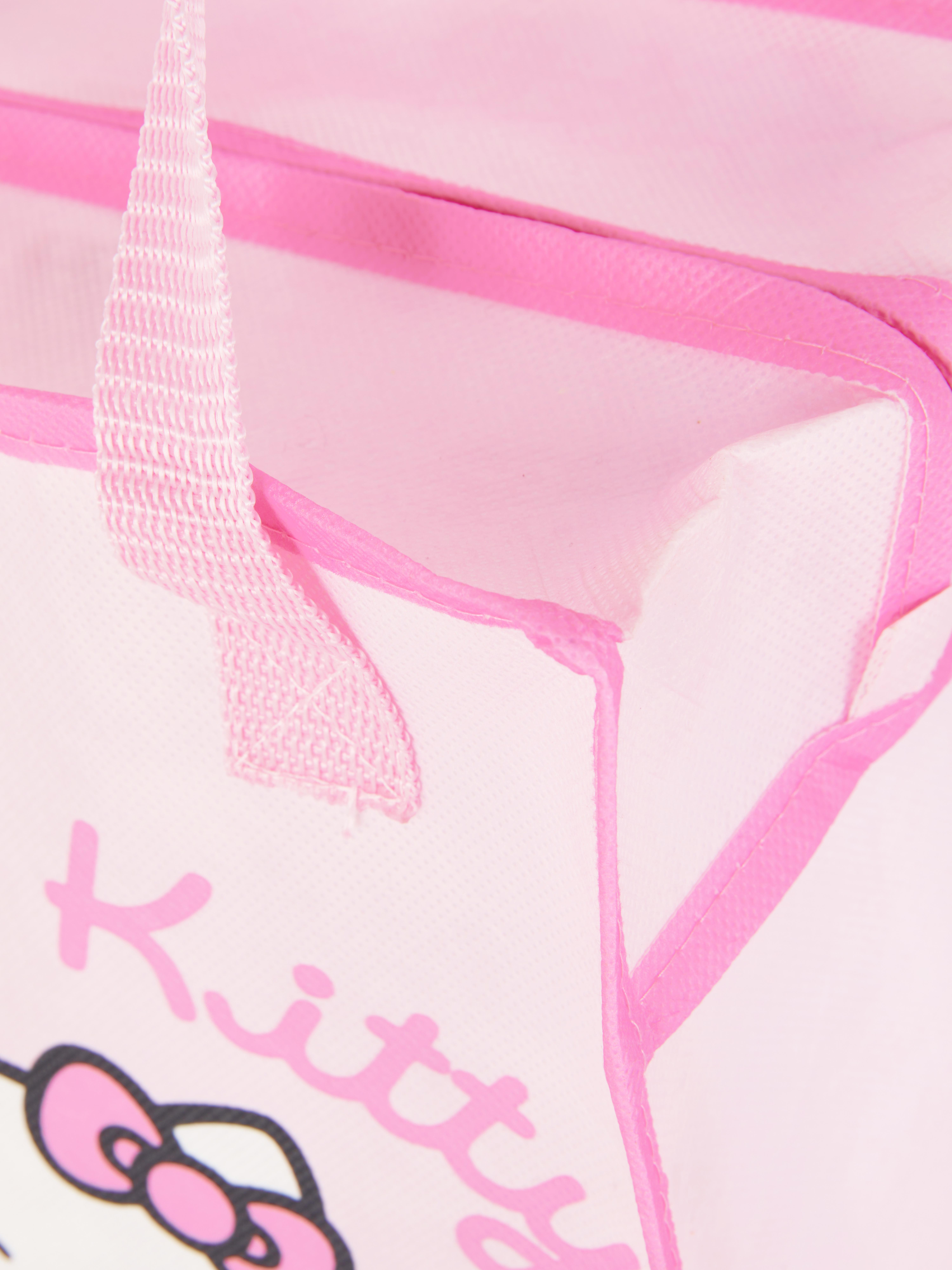 Geantă de prânz Hello Kitty O geantă de prânz cu fermoar, mânere și un design drăguț cu Hello Kitty