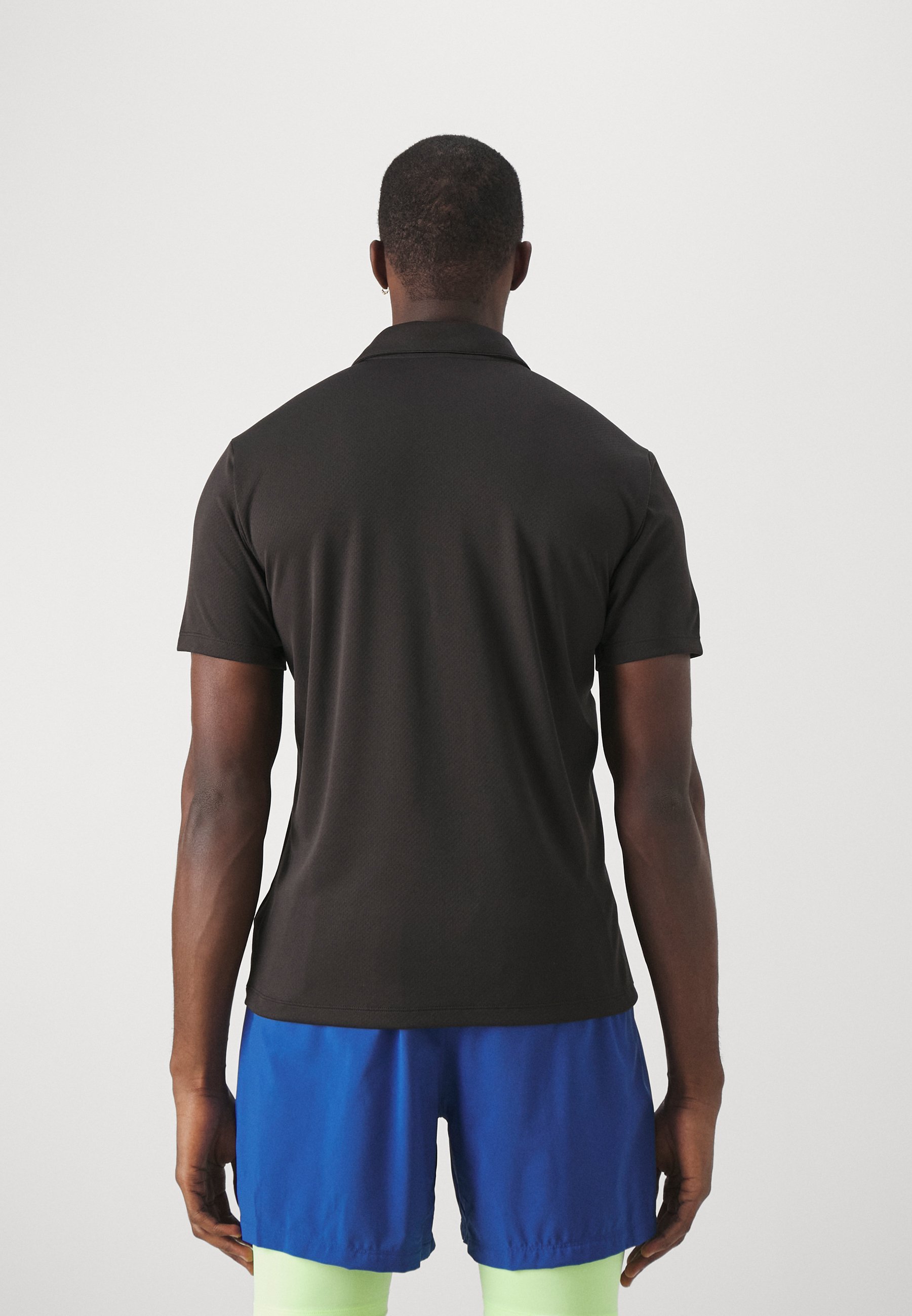 Puma TEAMGOAL - Poloshirt - zwart/wit/mat donkergrijs