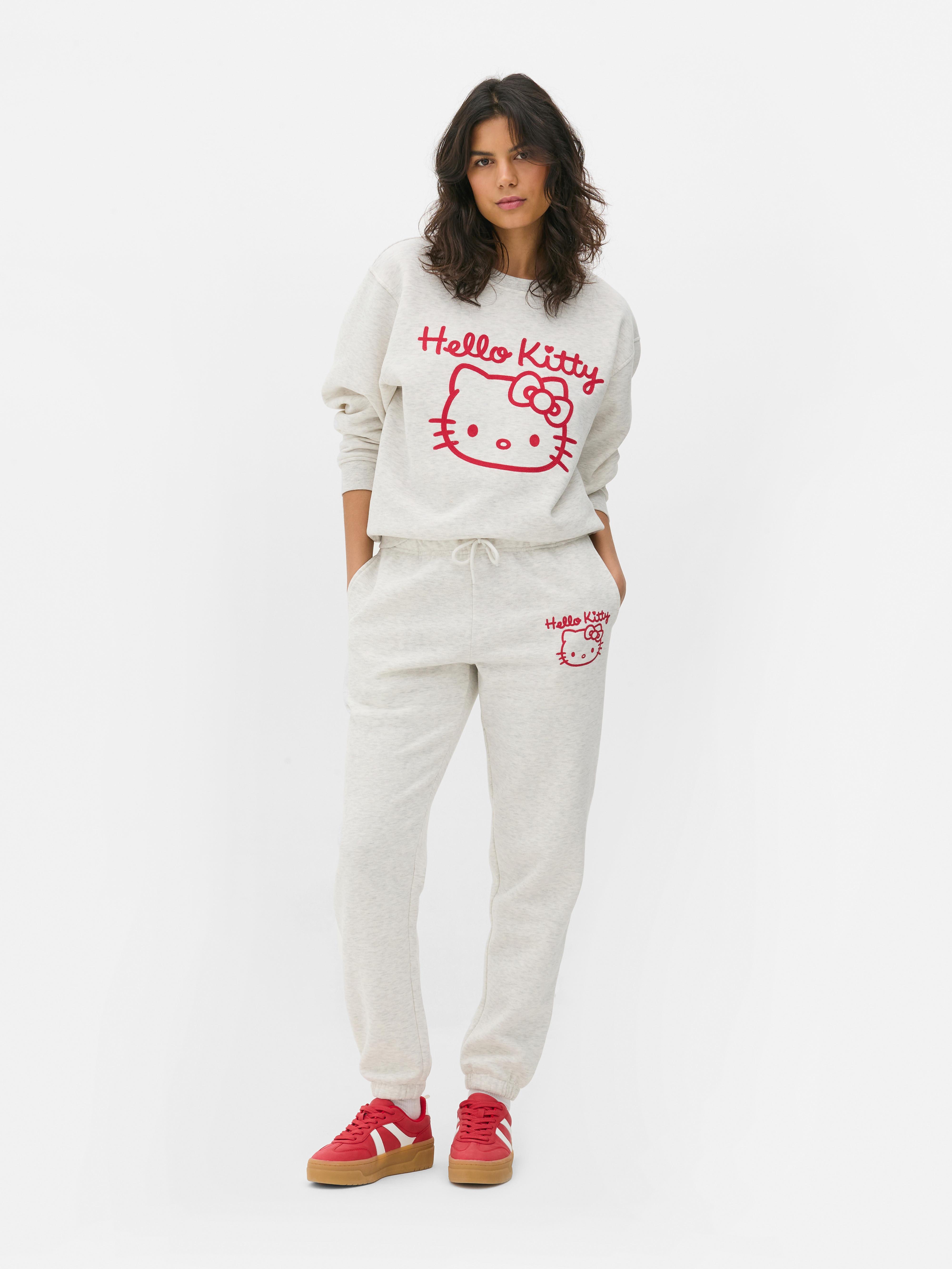 Hanorac cu imprimeu Hello Kitty Un hanorac cu umeri căzuți, manșete cu nervuri și imprimeu Hello Kitty