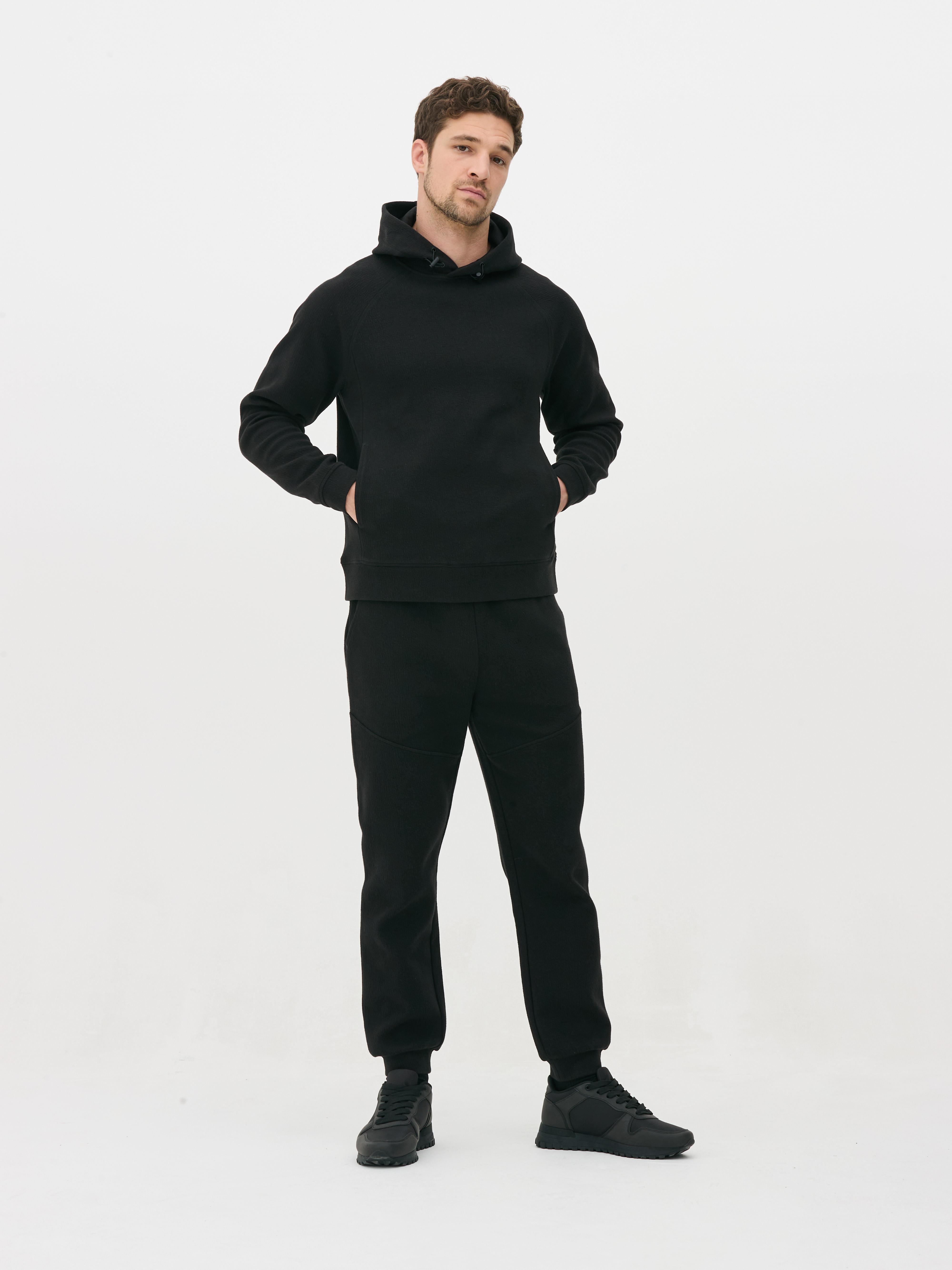 Pantaloni de trening texturați cu șnur de strângere Pantaloni de trening cu șnur de strângere, buzunare laterale, clinuri și manșete la gleznă