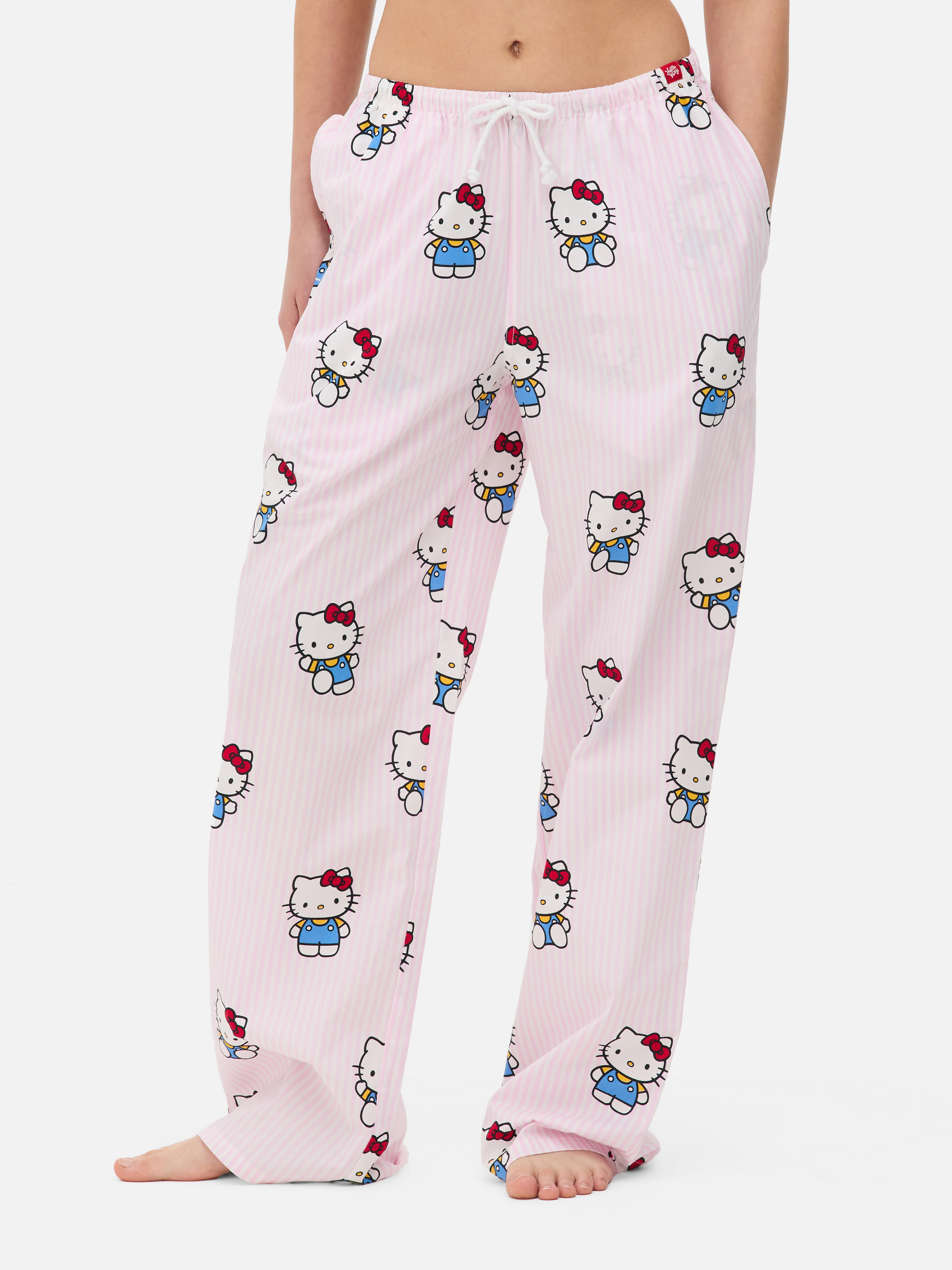 Pantaloni de pijama Hello Kitty și prietenii. Pantaloni de pijama cu șnur, buzunare laterale și personaje Hello Kitty.
