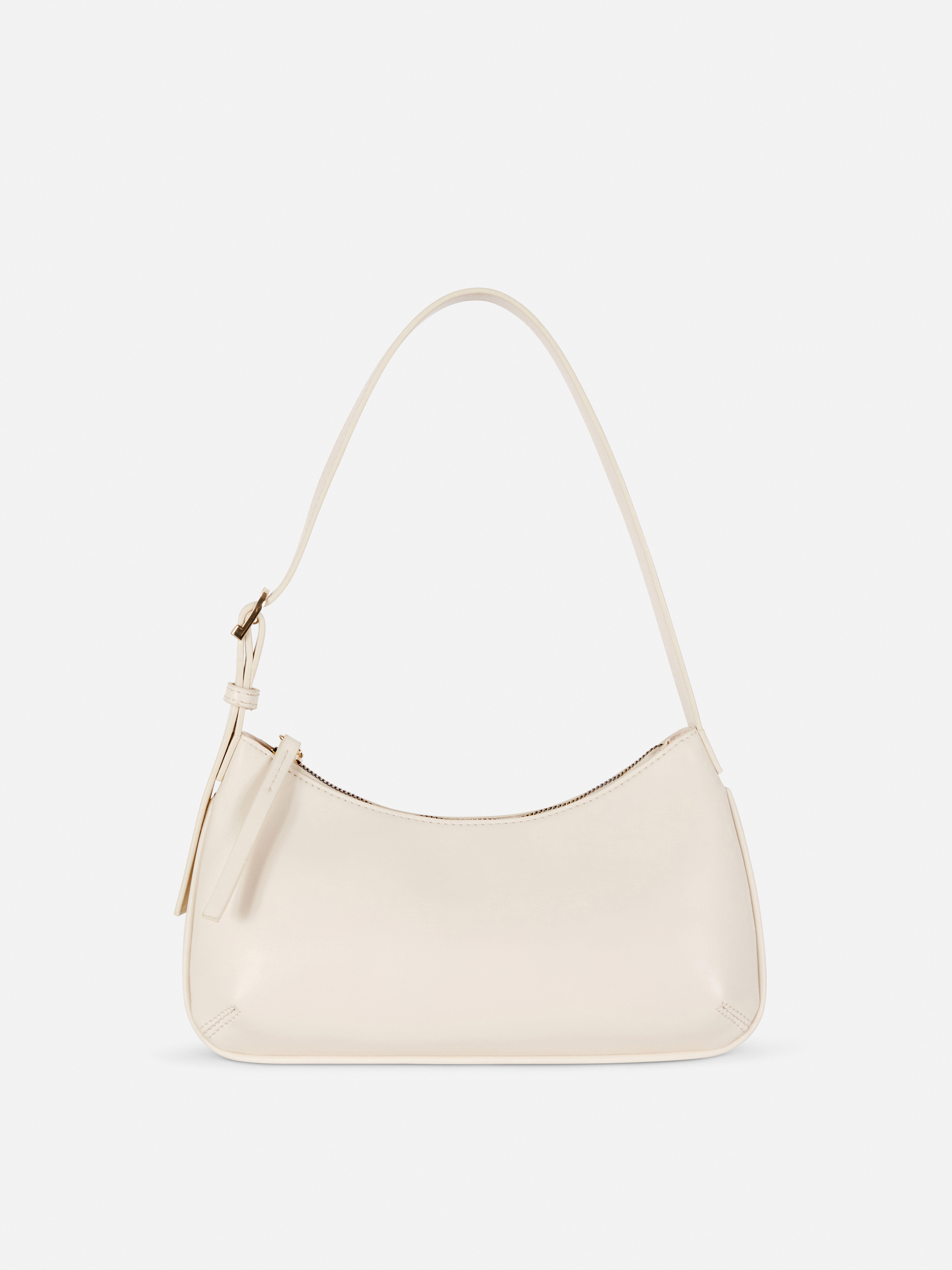 Schultertasche aus Kunstleder. Eine Tasche aus Kunstleder mit Reißverschluss und verstellbarem Schultergurt.