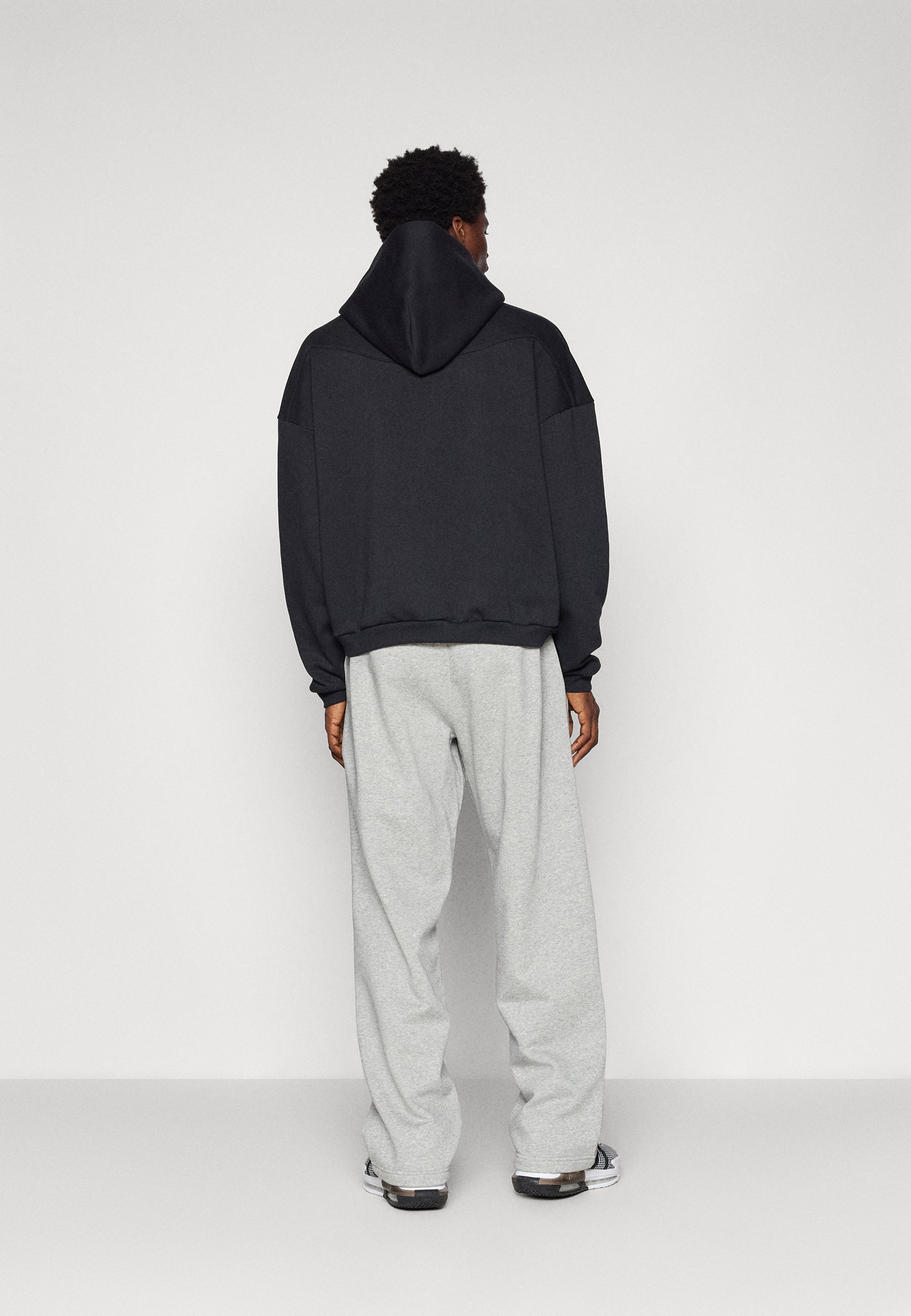 Pantalon de survêtement Nike Performance à ourlet ouvert - gris chiné foncé/noir