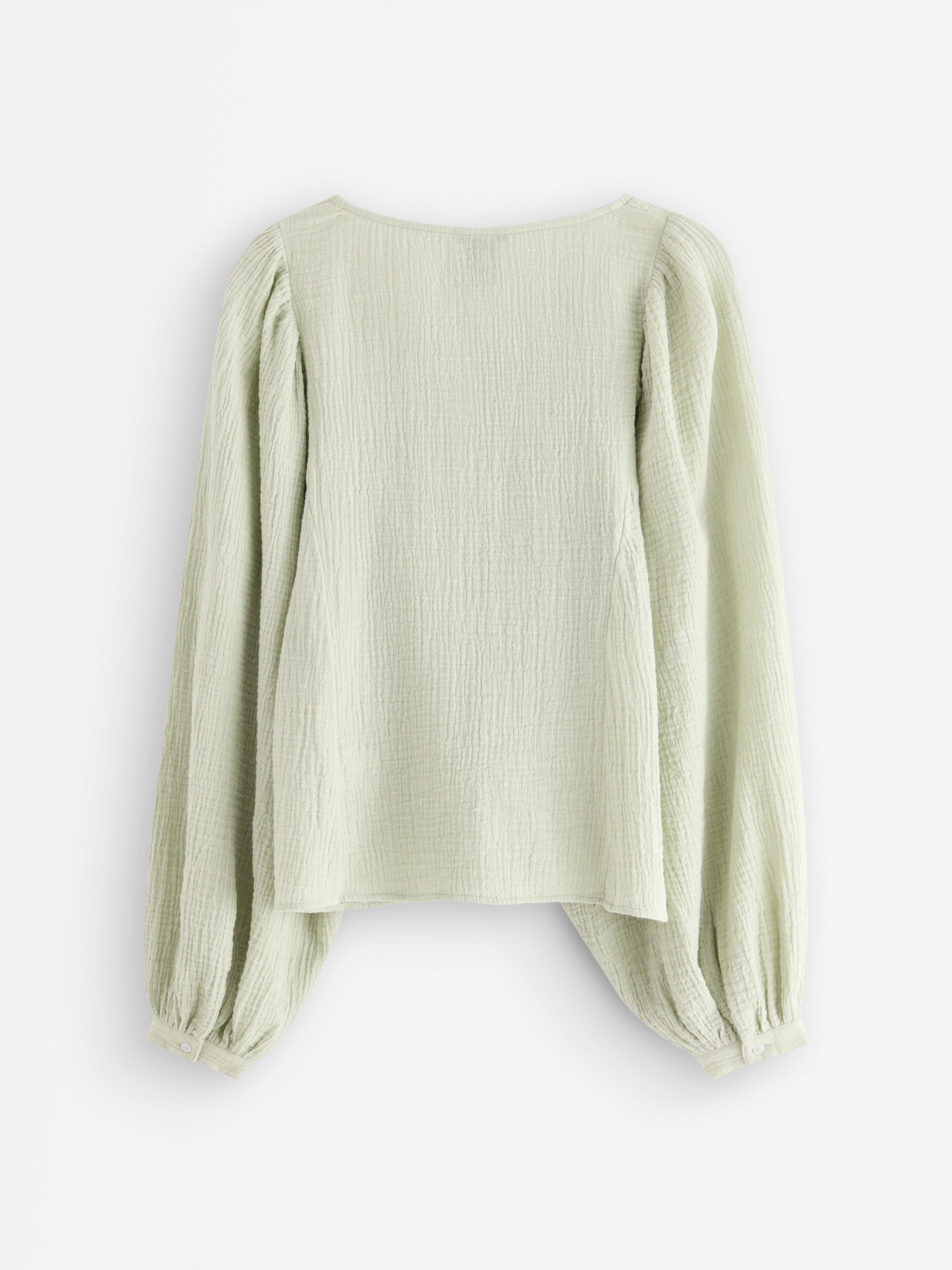 Blusa em tecido de algodão verde claro acinzentado