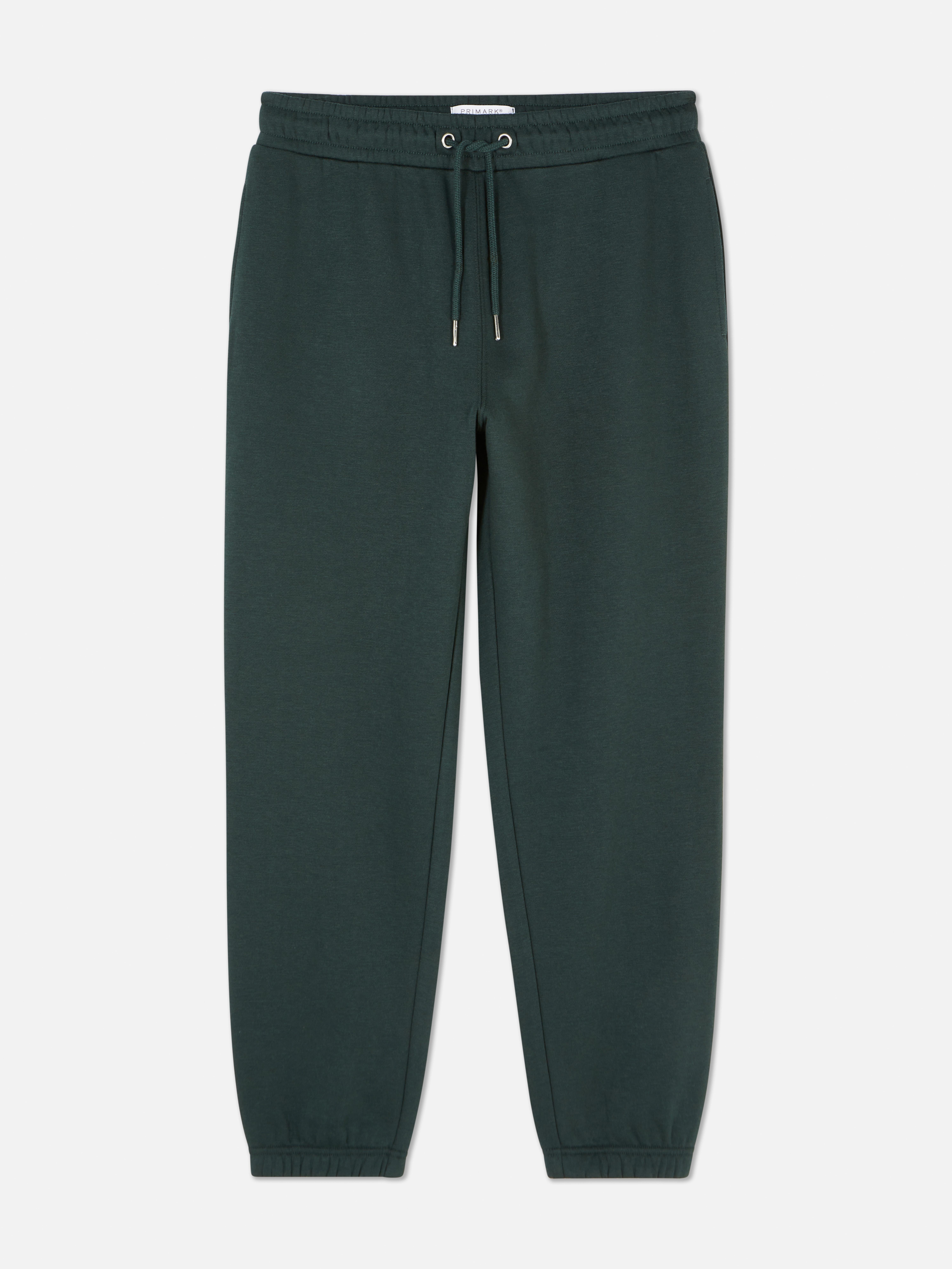 Pantaloni de jogging esențiali cu șnur de strângere Acești pantaloni de jogging confortabili cu șnur de strângere și buzunar aplicat la spate sunt casual și potriviți pentru relaxare