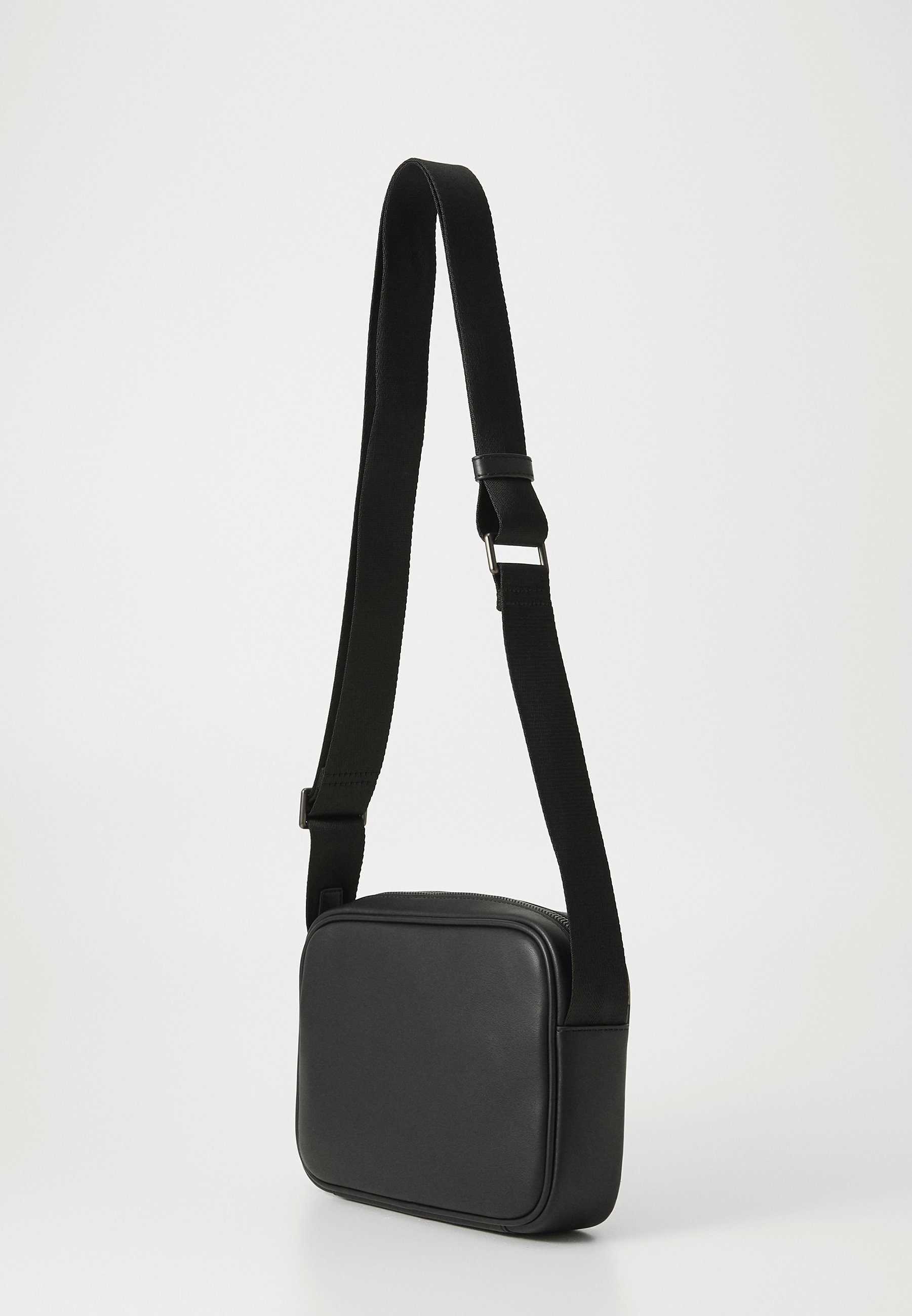 Tommy Hilfiger MONOGRAM REPORTER - Crossbodytas - zwart