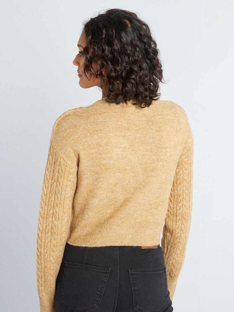 Gebreid vest met gedraaide details - BEIGE