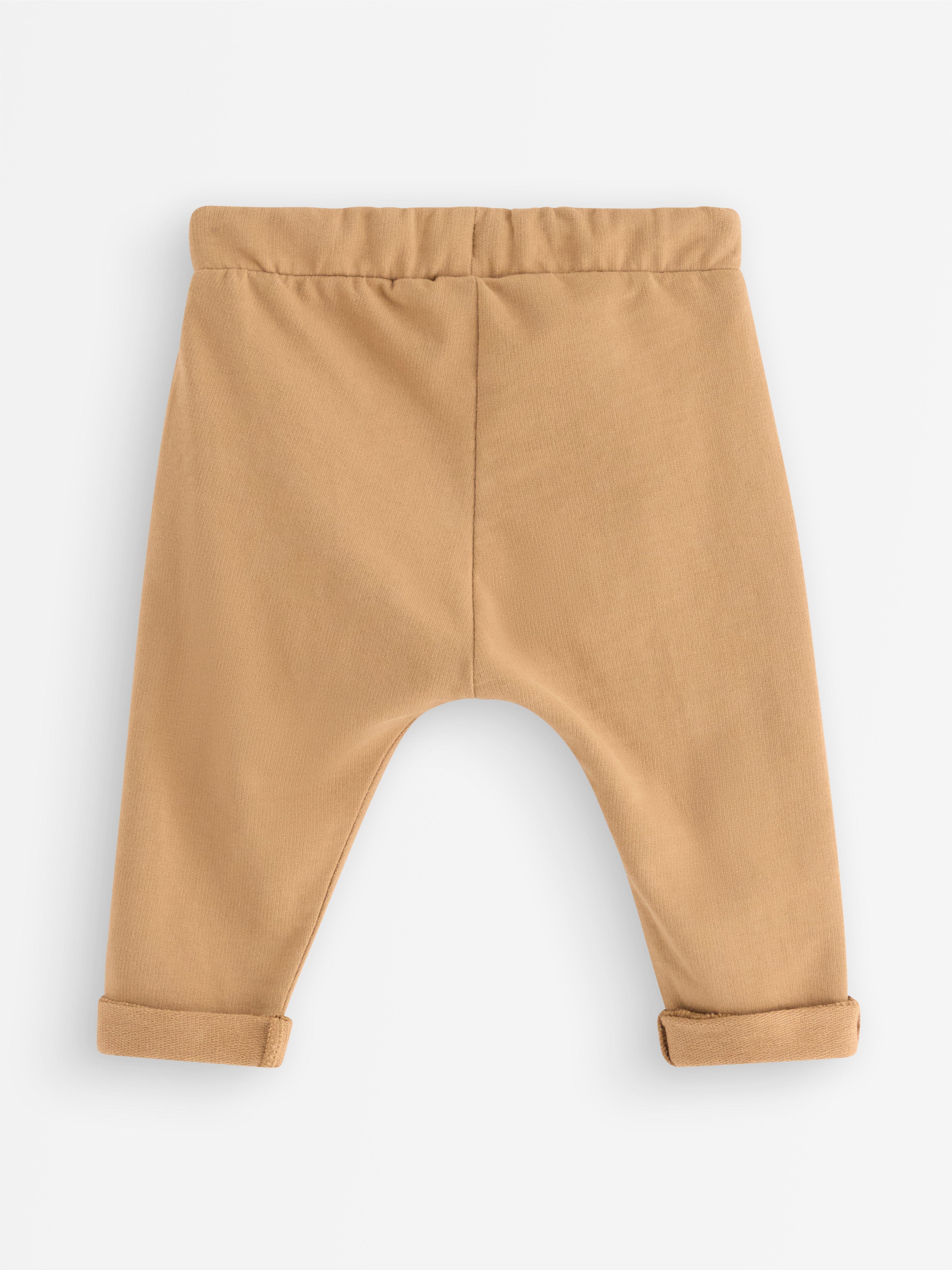 Pantalones deportivos color beige claro empolvado