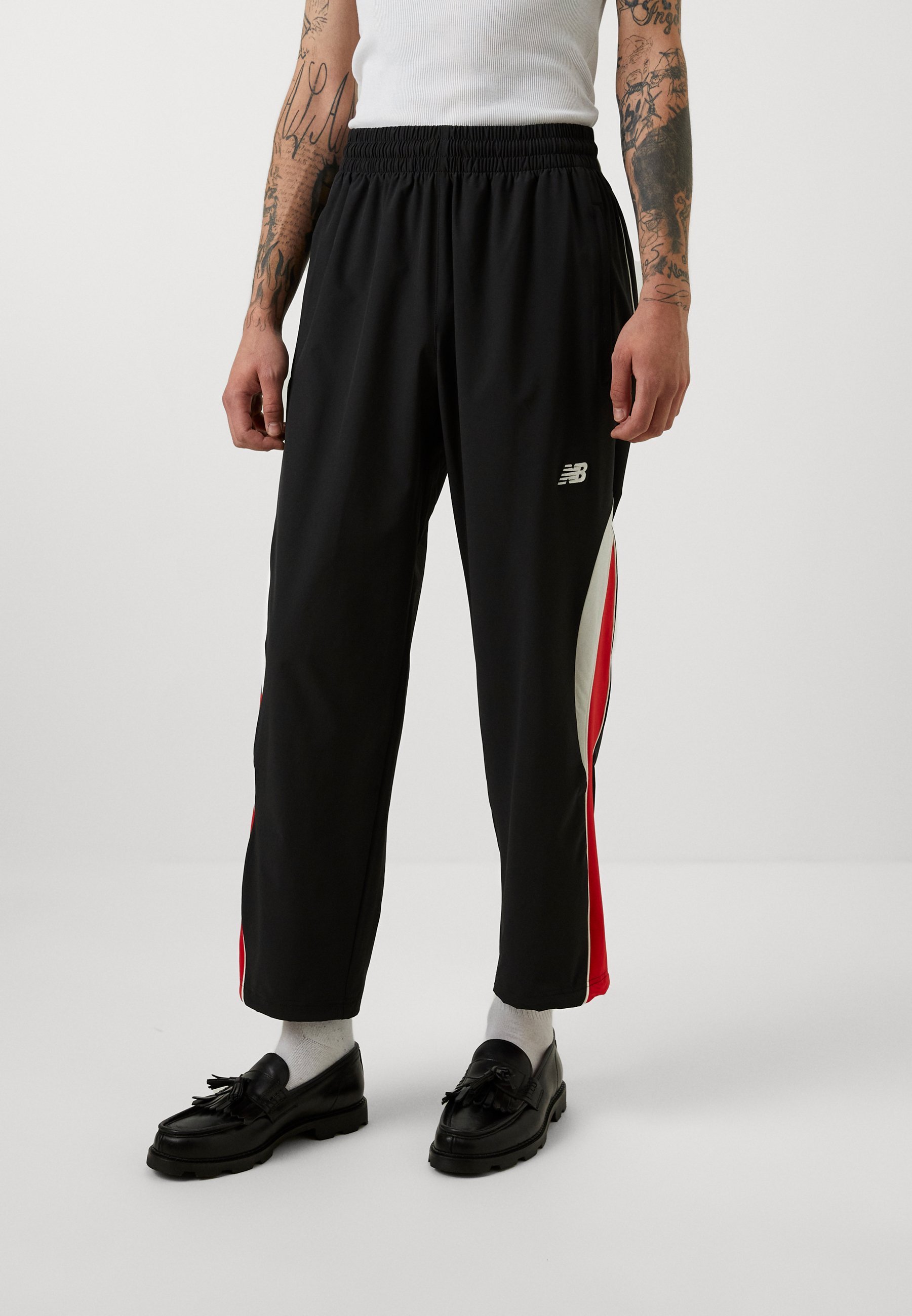 IN GAME TRACK PANT - Verryttelyhousut - blackNew Balance