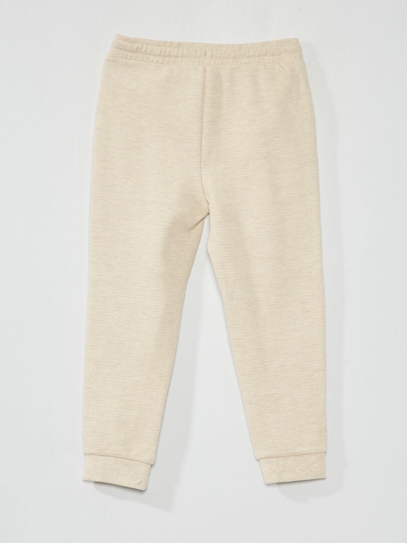 Joggingbroek van katoenpiqué - lossere pasvorm - beige