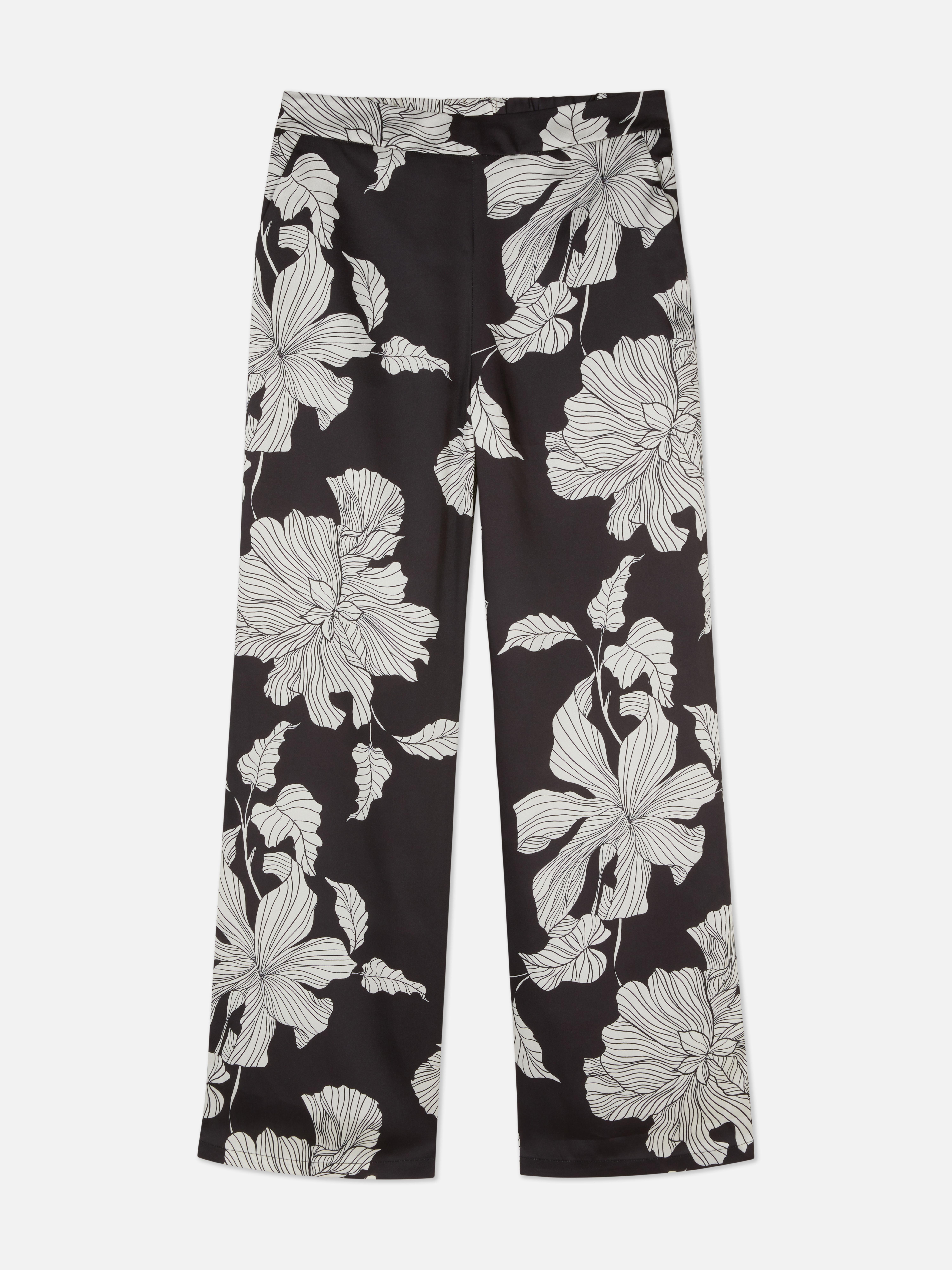Passende Satinhose mit Blumenmuster. Gerade geschnittene Satinhose mit durchgehendem Blumenmuster.