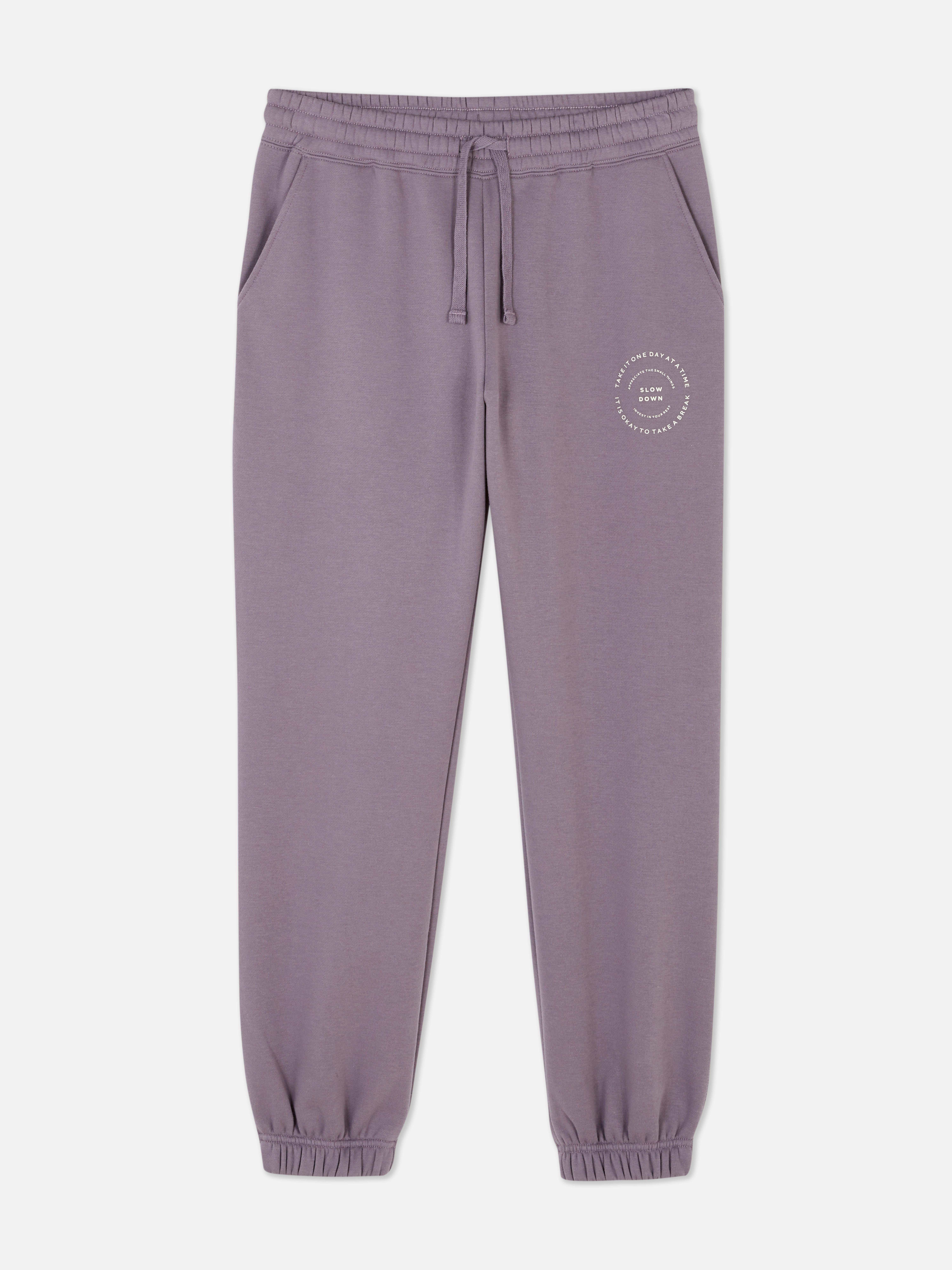 Matching printed sweatpants with drawstring Sweatpants with drawstring, ankle cuffs, side pockets, and a nice graphic detail