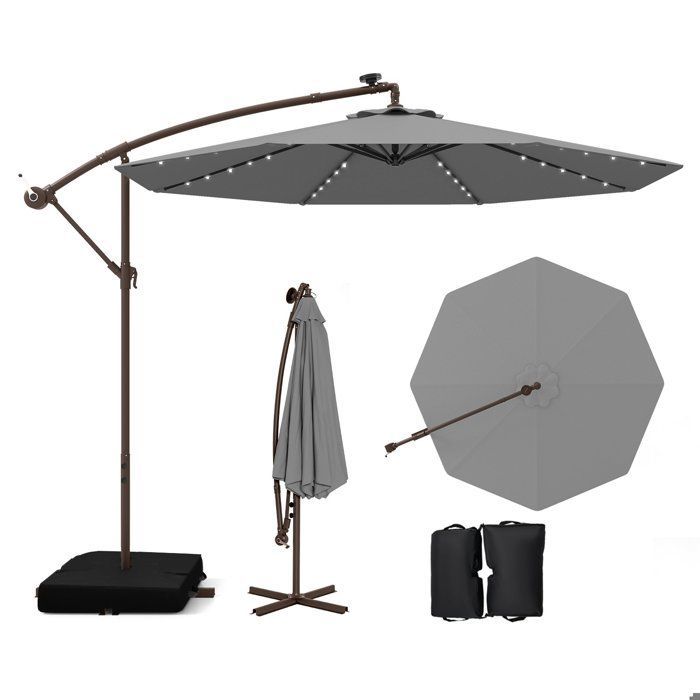 Ombrellone decentrato COSTWAY da 3 m con 40 LED - Base a croce con sacco di sabbia - Tessuto in poliestere grigio con protezione UV 20+ - Pannello solare da 6 ore