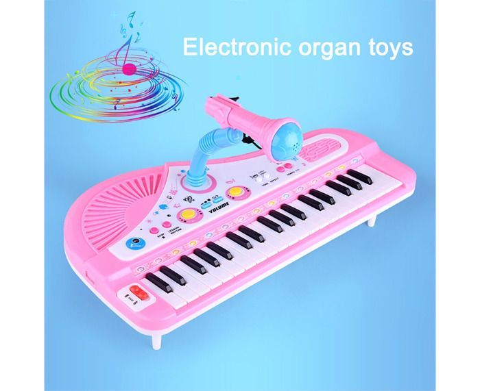 Piano electrónico de 37 teclas con micrófono para niños que aprenden a tocar un instrumento musical.