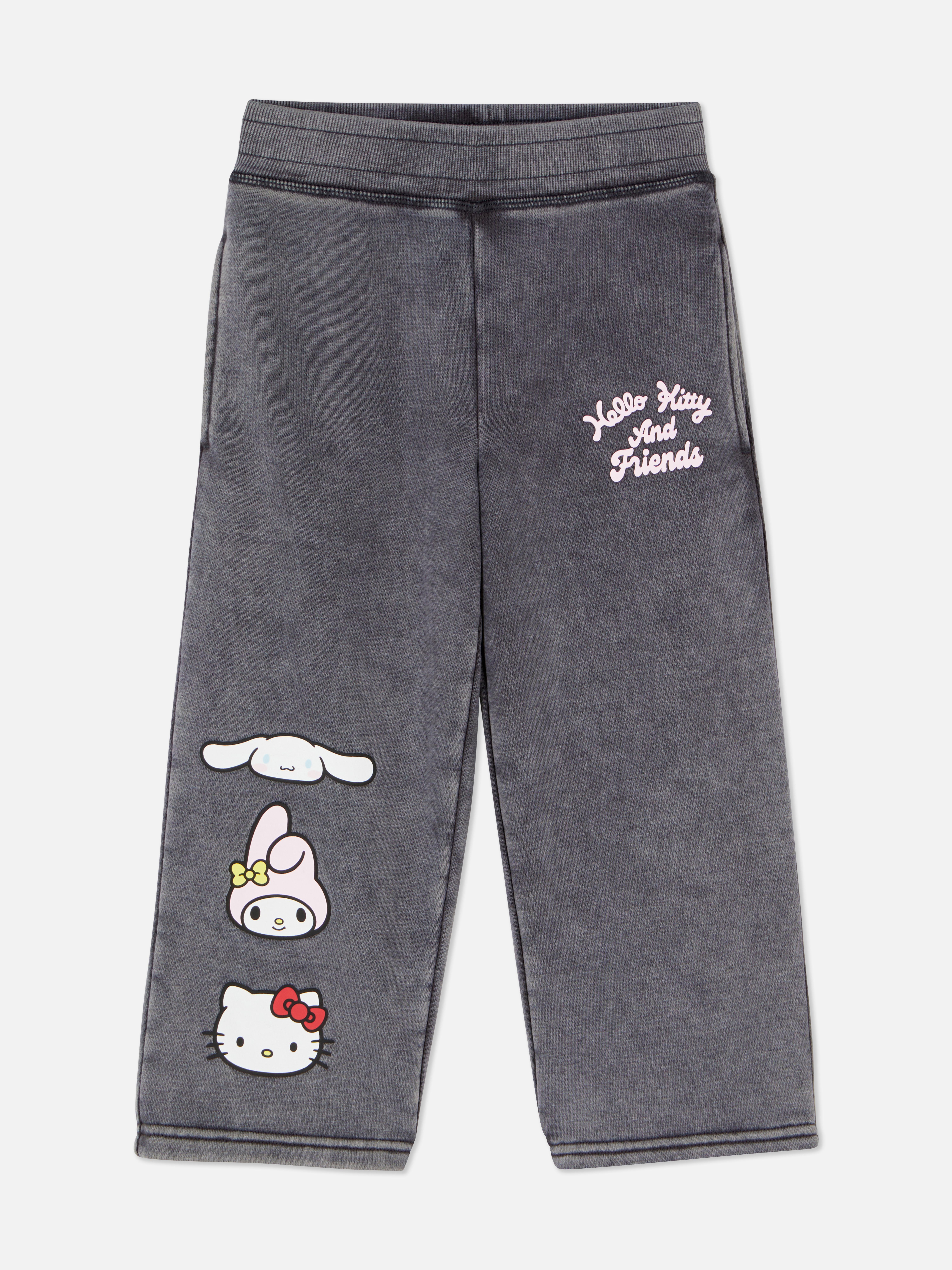 Savmosásos Hello Kitty és barátai melegítőnadrág. Savmosásos melegítőnadrág széles szárral, gumírozott derékkal és zsebekkel.