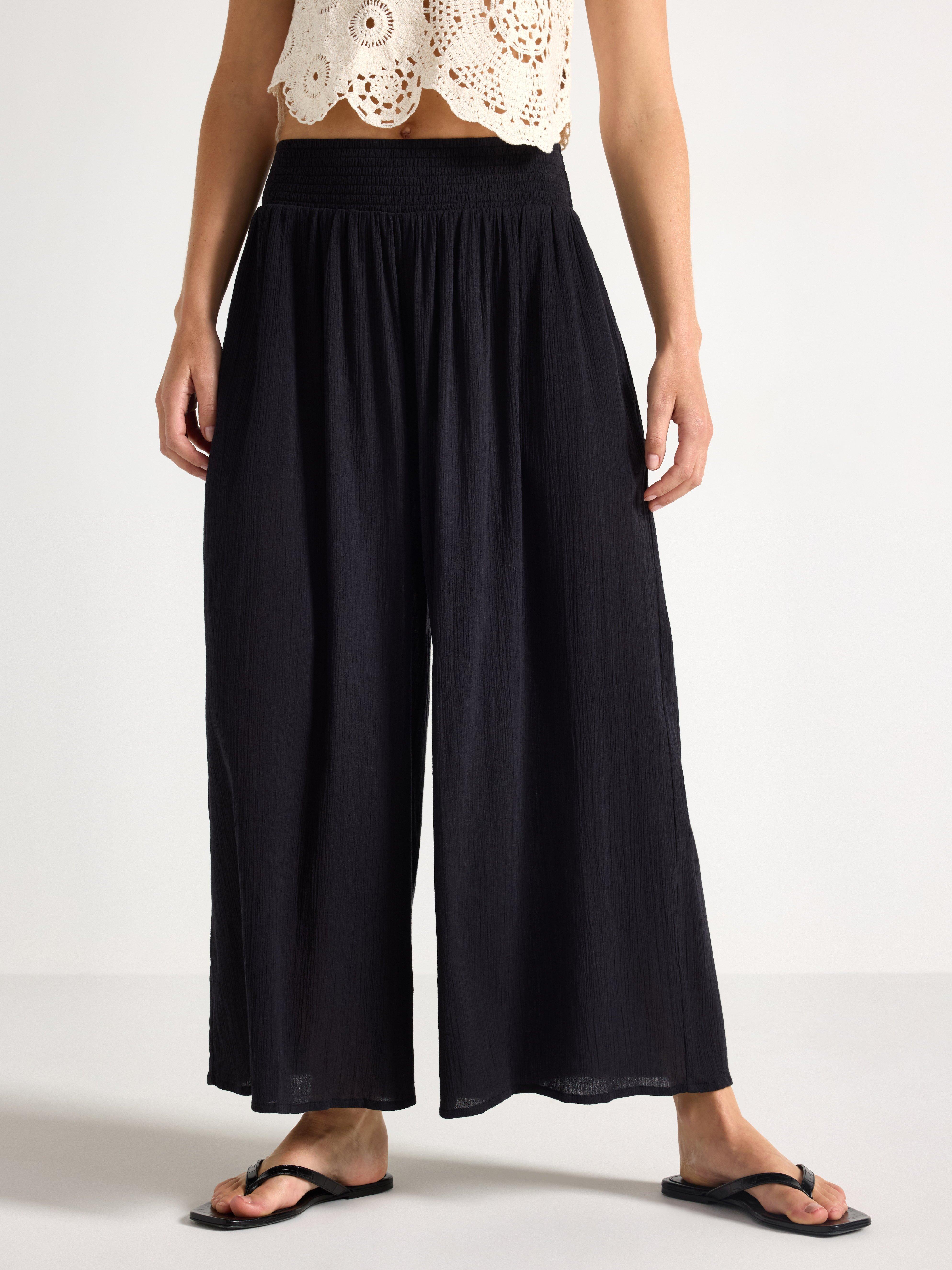 Pantalones anchos tobilleros negros