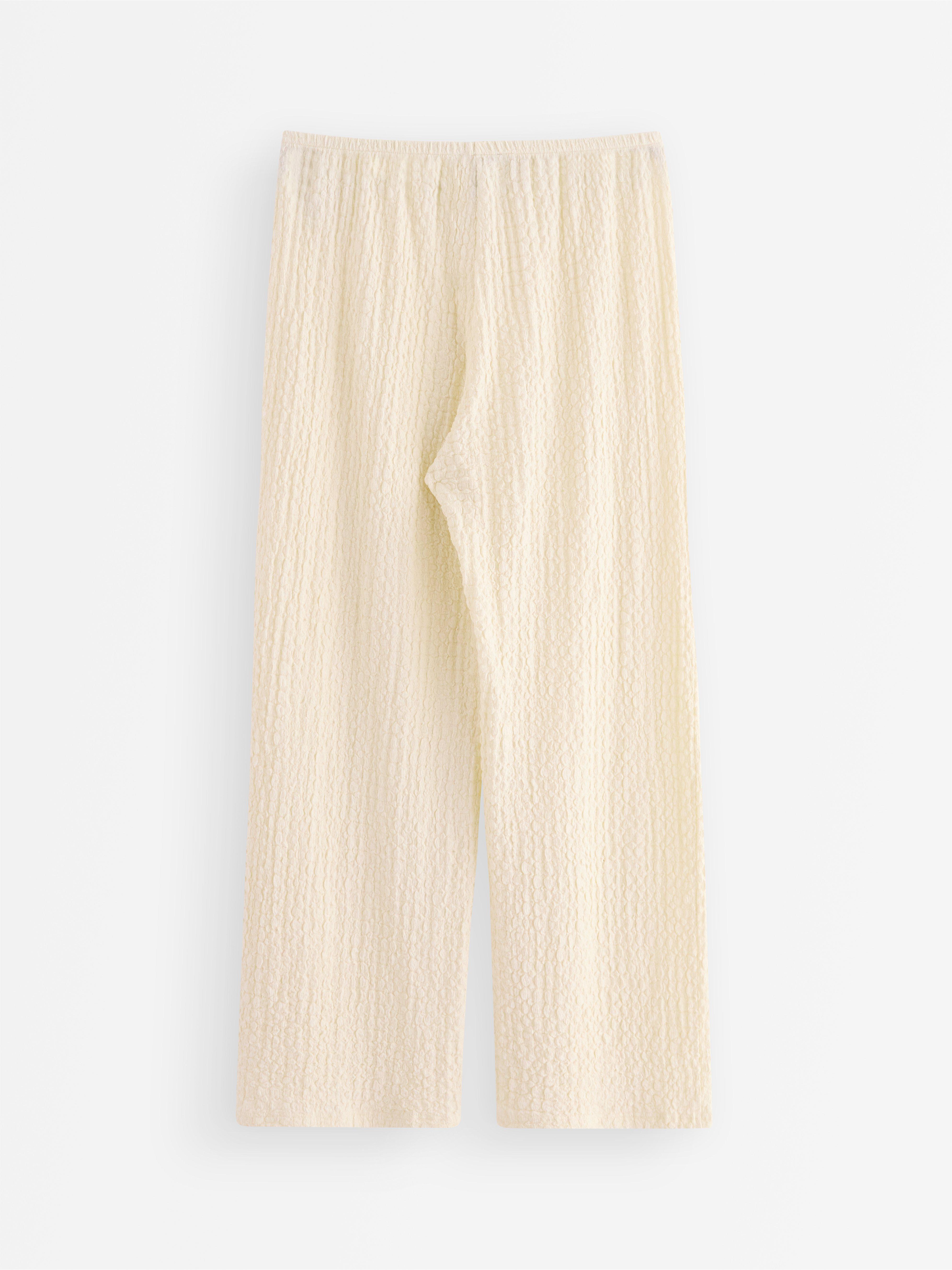 Pantalones de punto texturizado color blanco roto